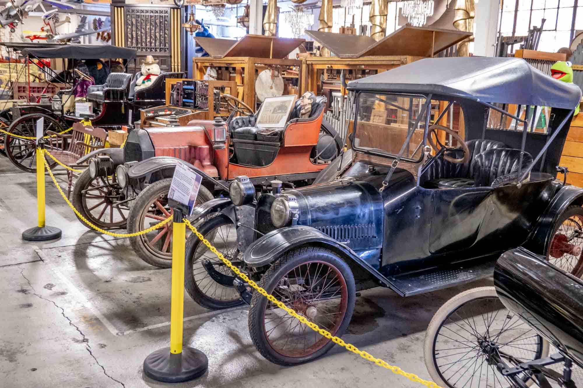 Row of antique cars on display at the American Treasure Tour Museum