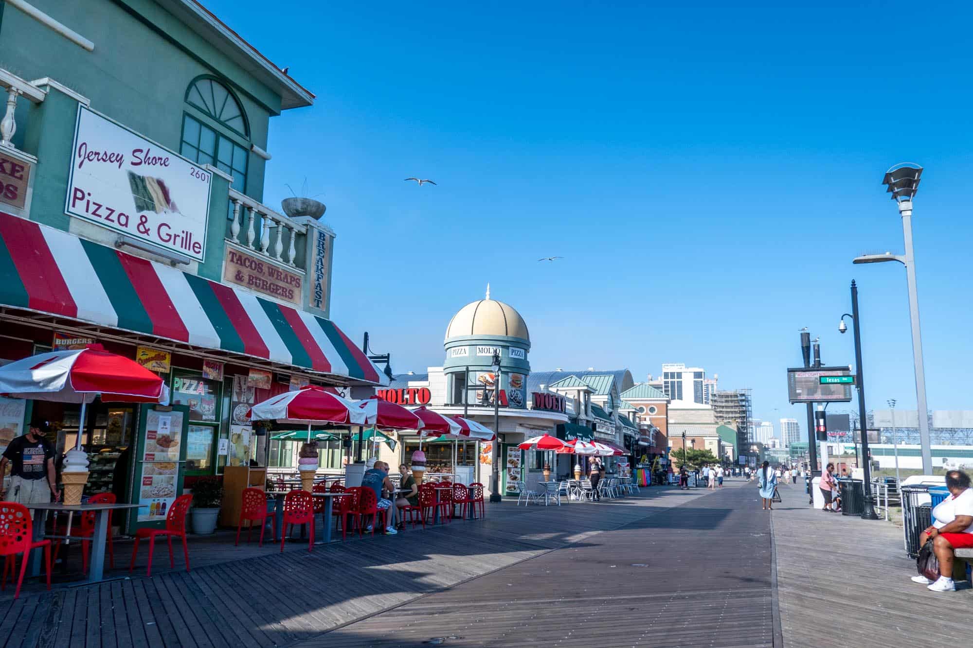 Boardwalk in Atlantic City NJ lined with restaurants and buildings