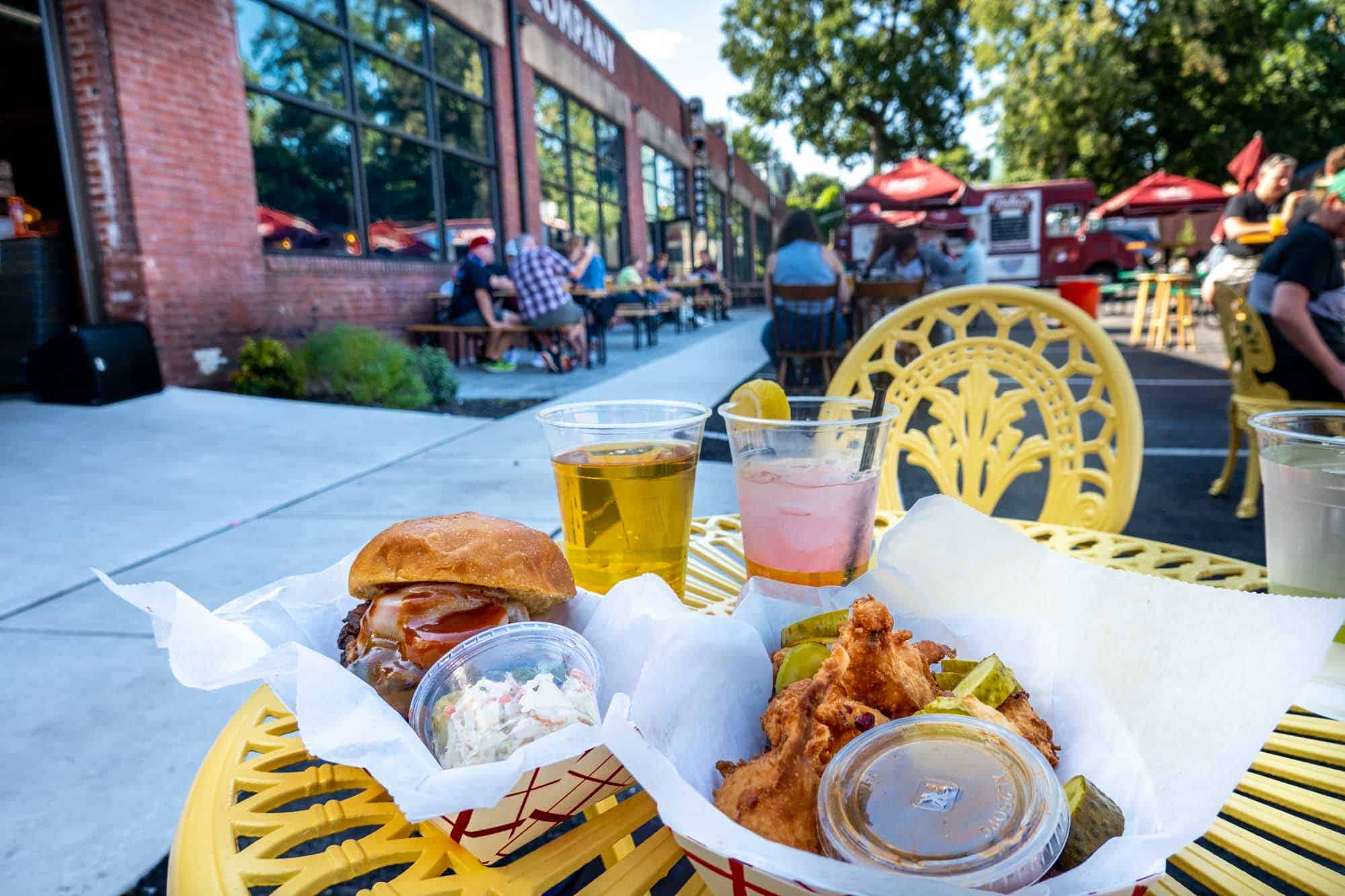 Table with glasses of beer and BBQ food