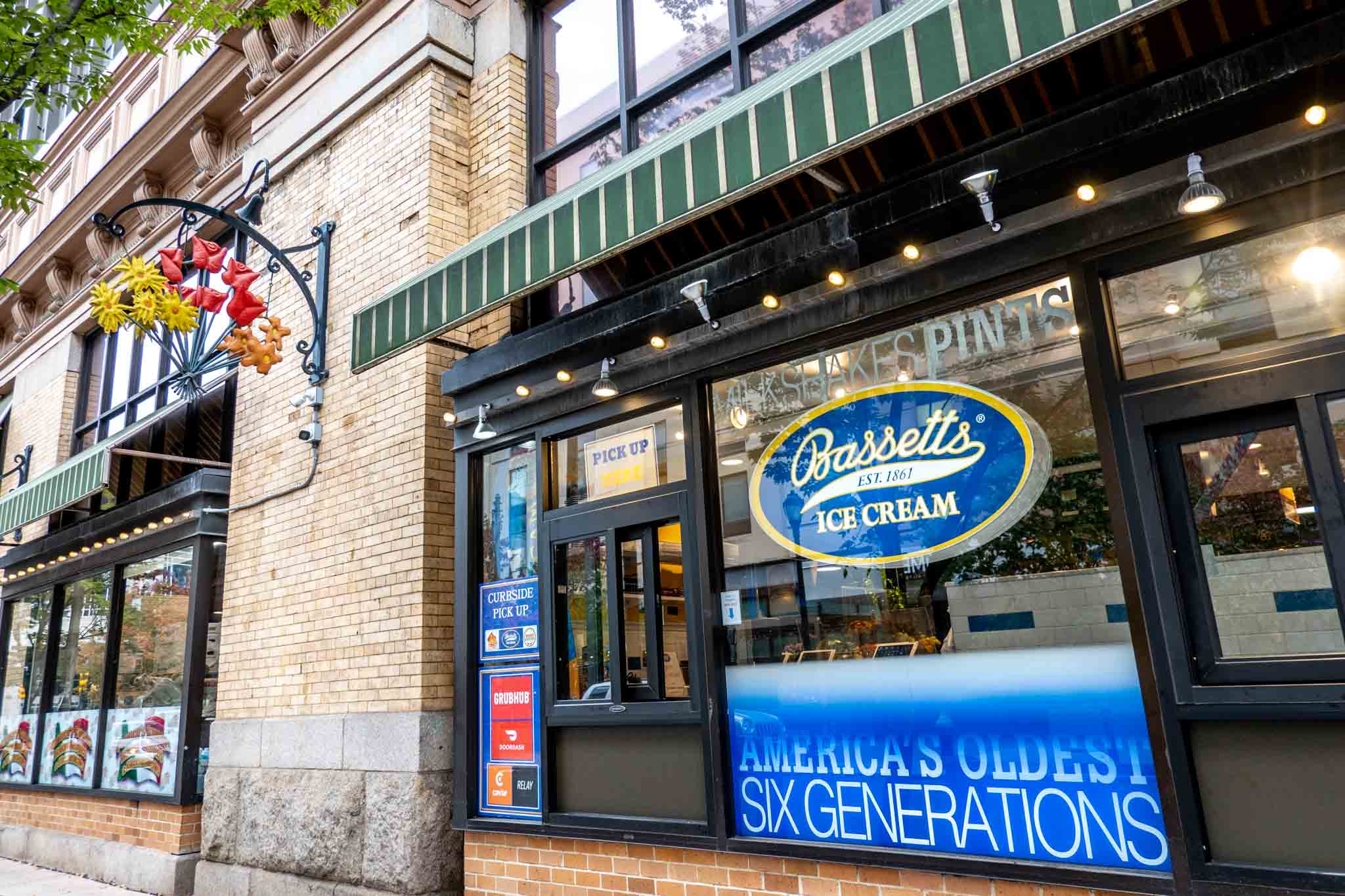 Exterior of building with takeout window and Bassetts sign