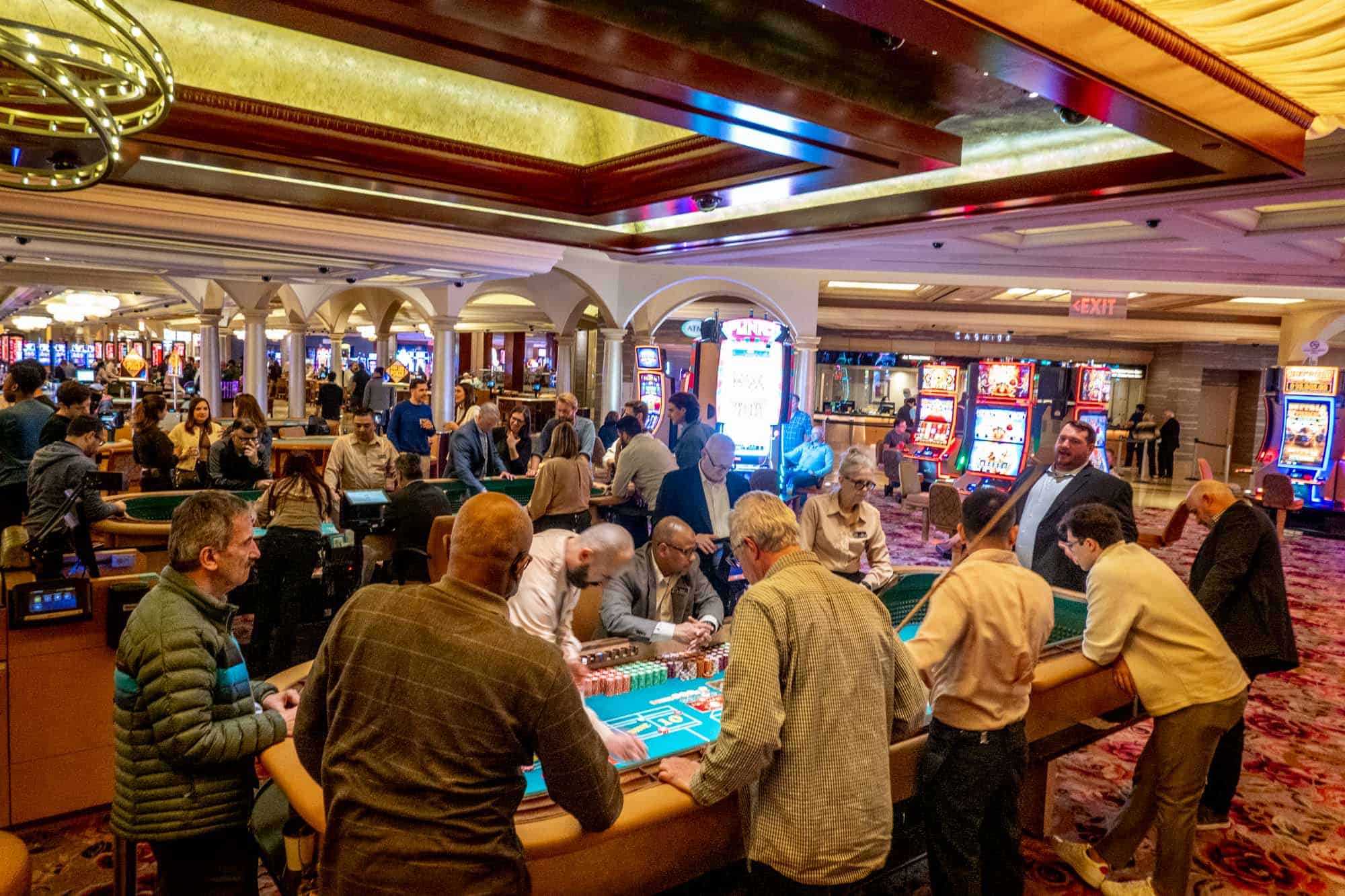 People playing table games in a casino.