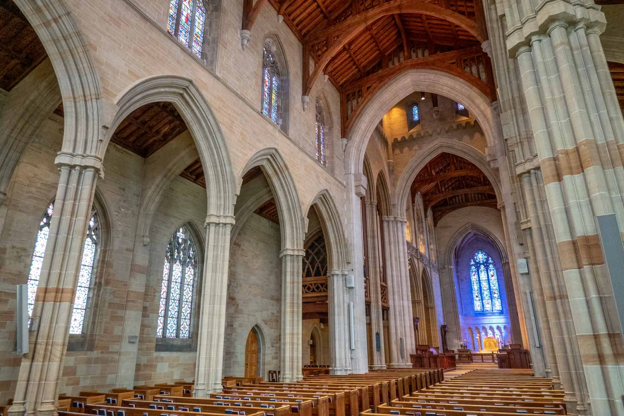 The cathedral's nave with pews and large columns.