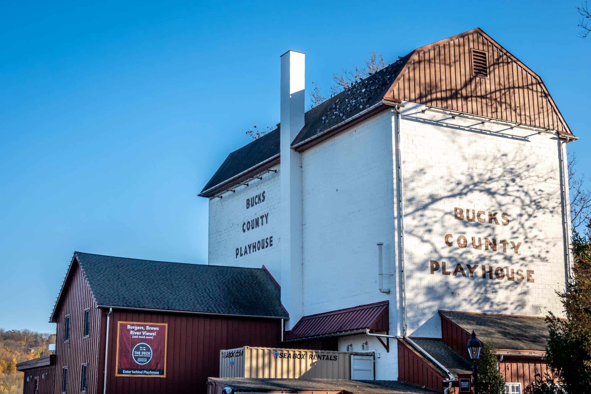 White building with a sign for Bucks County Playhouse