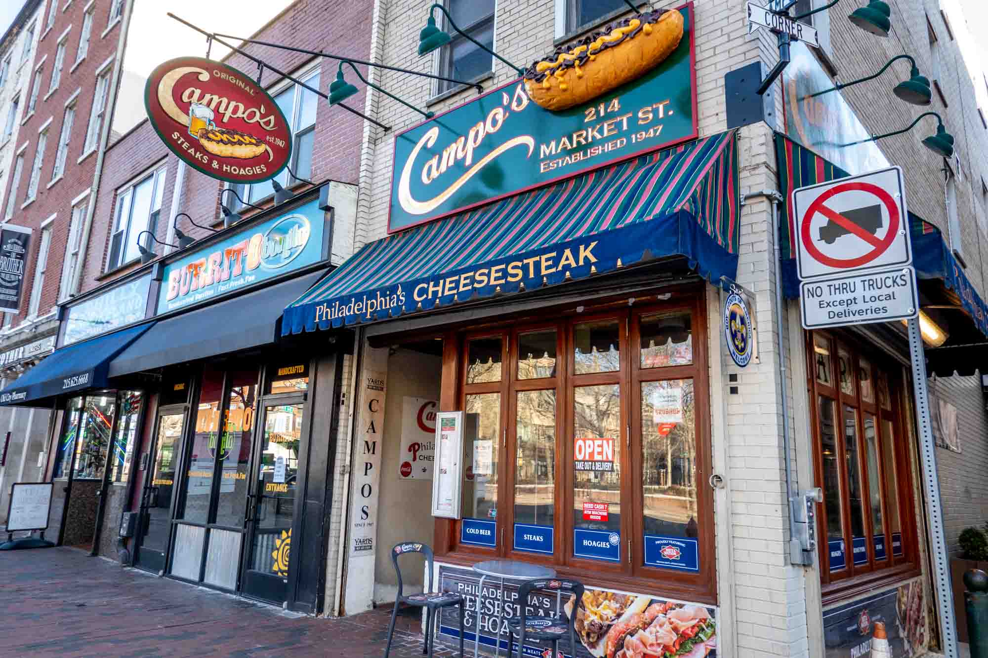 Exterior of a building with signage for "Campo's" and "Philadelphia's cheesesteak."