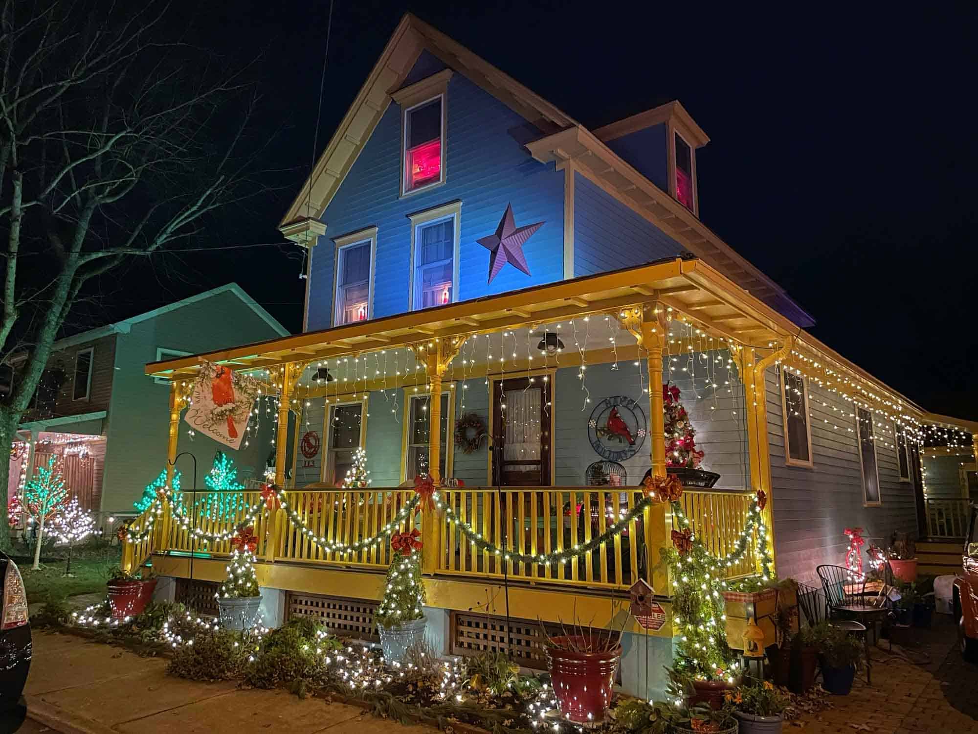 Brightly-colored house lit with Christmas lights in Cape May