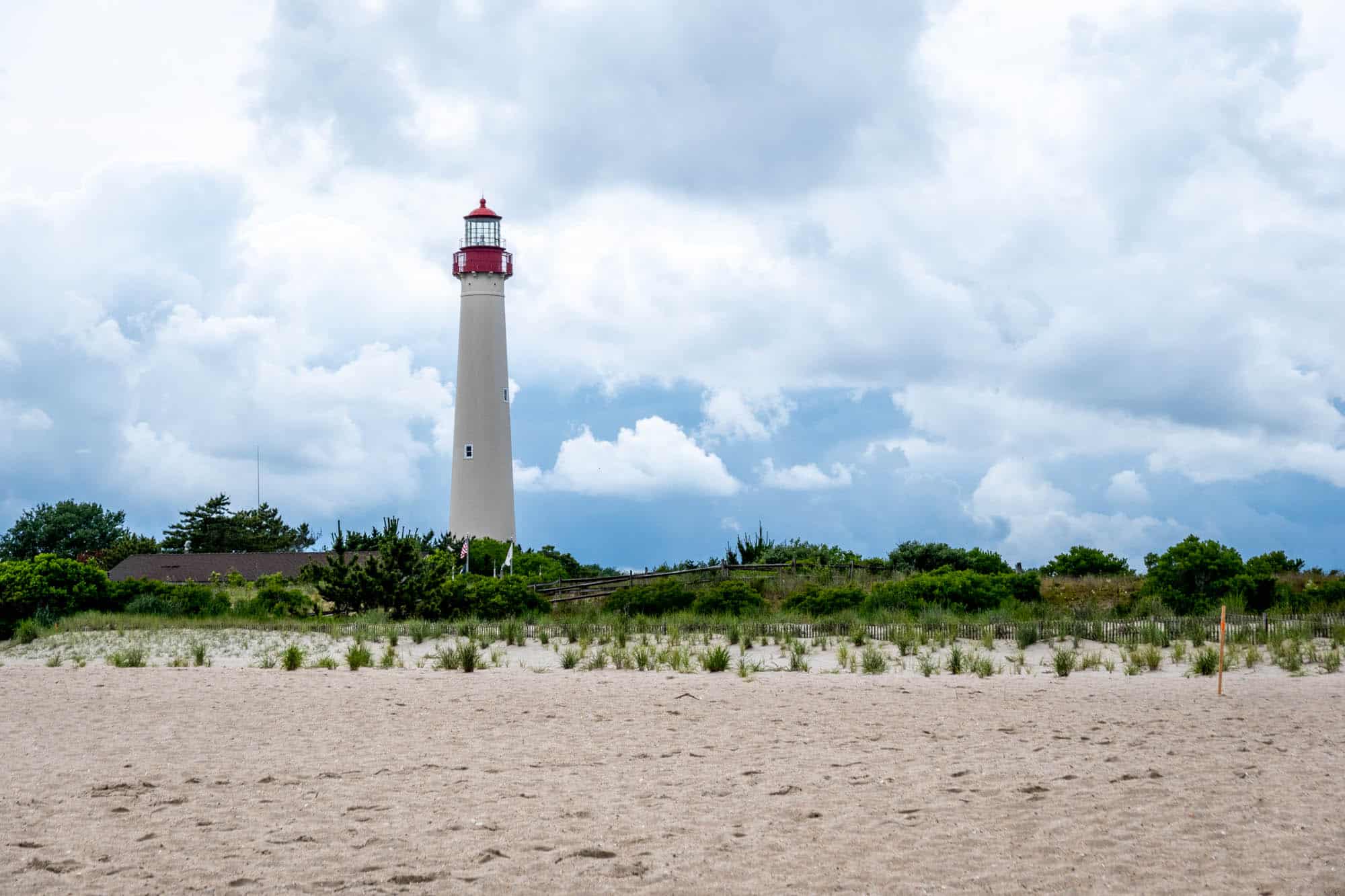 Lighthouse on a sandy beach.