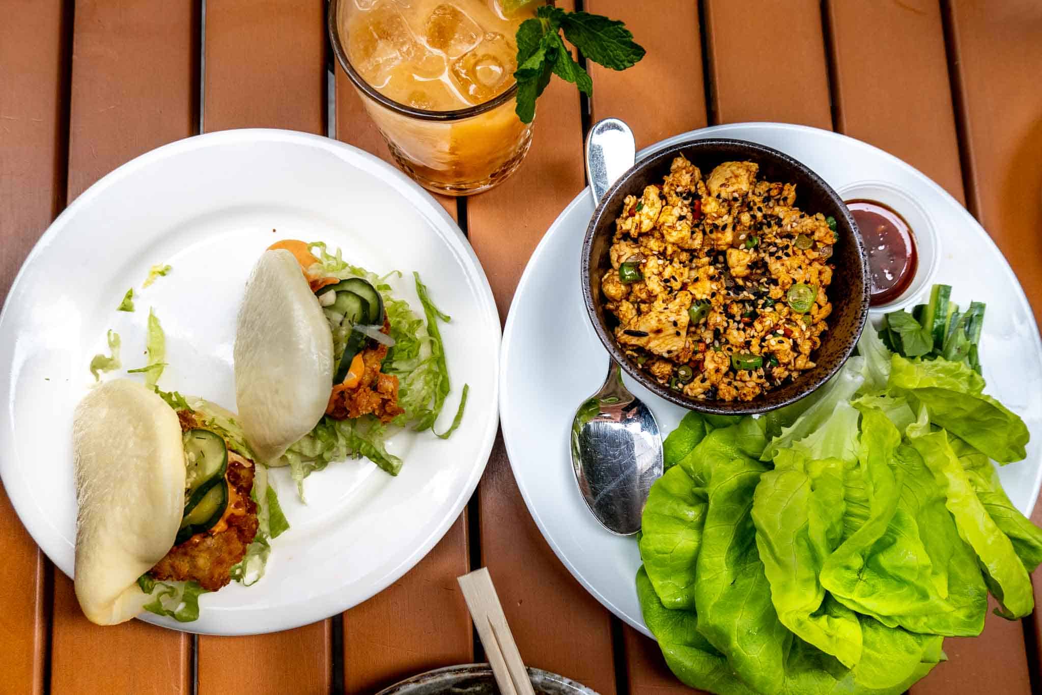 Asian food of chicken buns and lettuce wraps with cocktail at a Fishtown restaurant