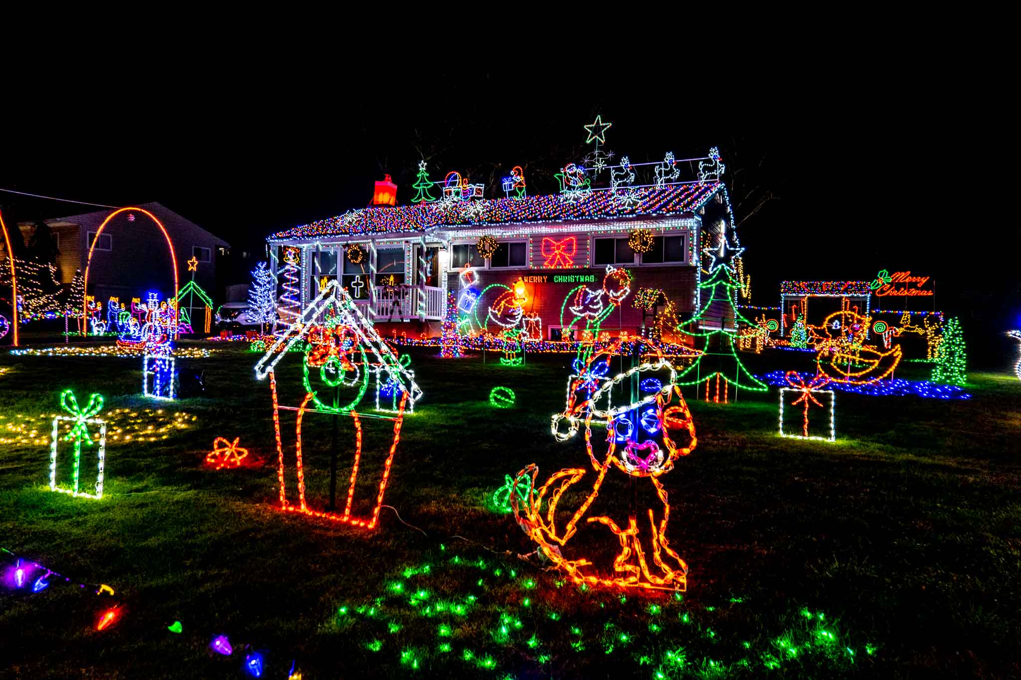 House and yard full of Christmas light displays