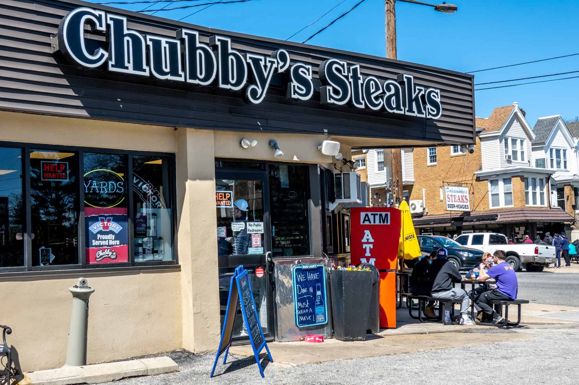 Exterior of a storefront with a sign for "Chubby's Steaks."