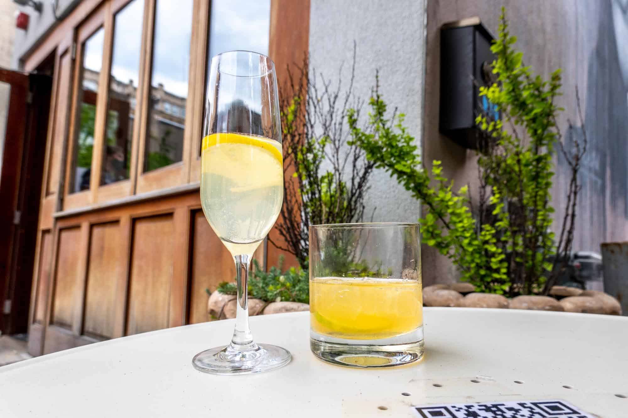 Two cocktail glasses on an outside table