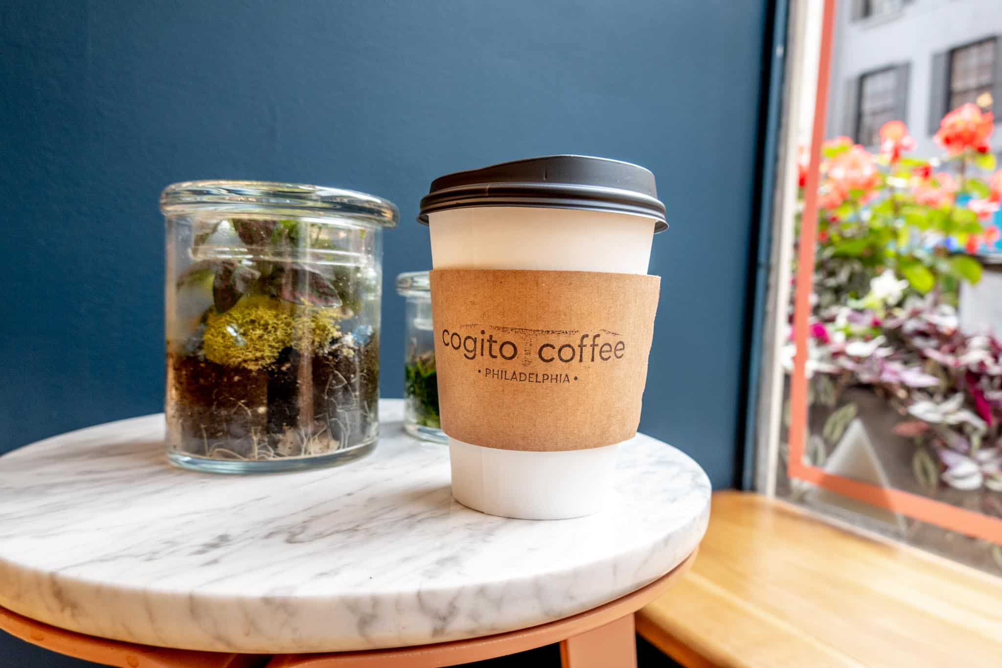Cup labeled "Cogito Coffee, Philadelphia" on a table