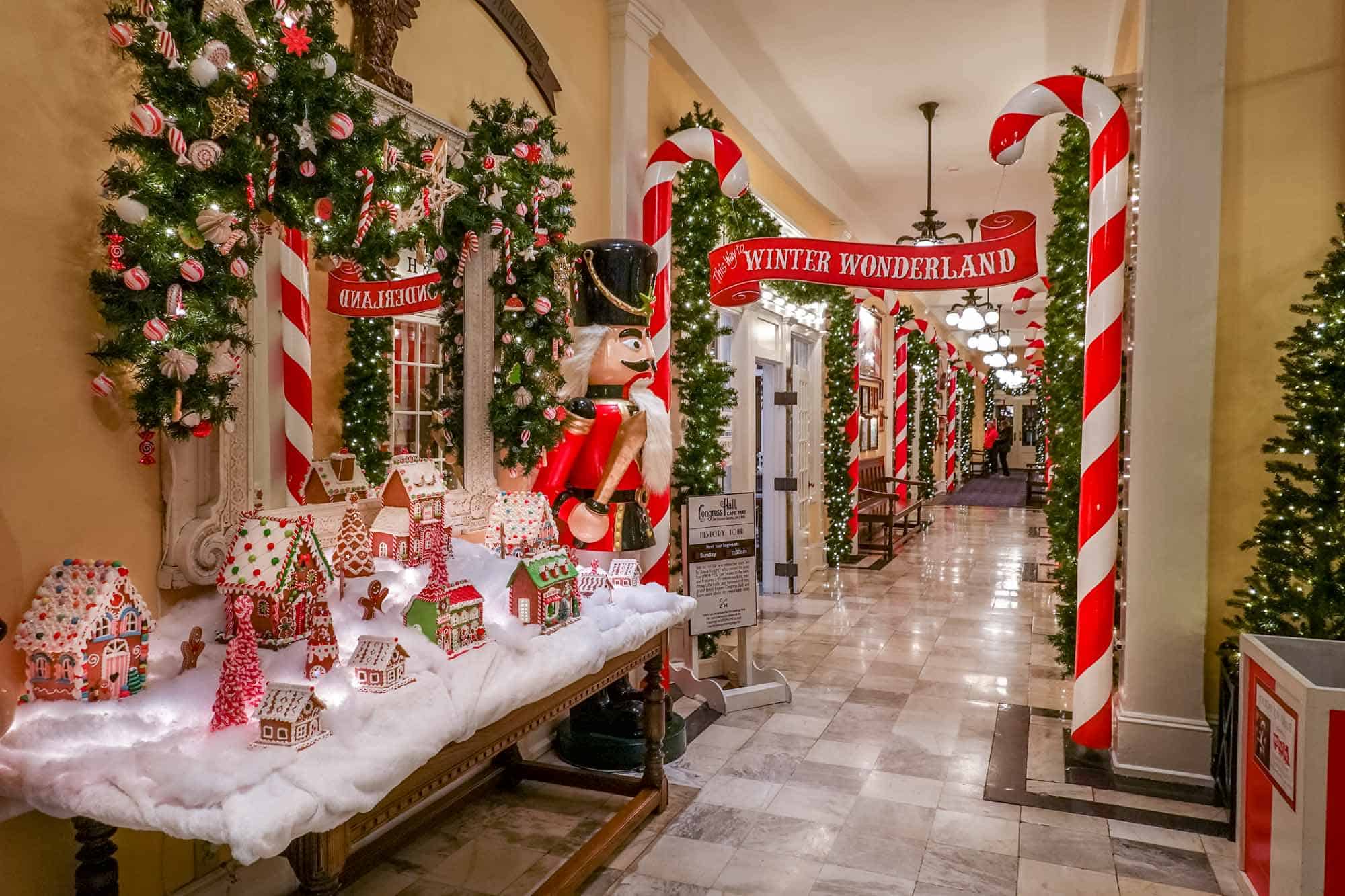 Hallway lined with Nutcrackers, garland, and other Christmas decorations
