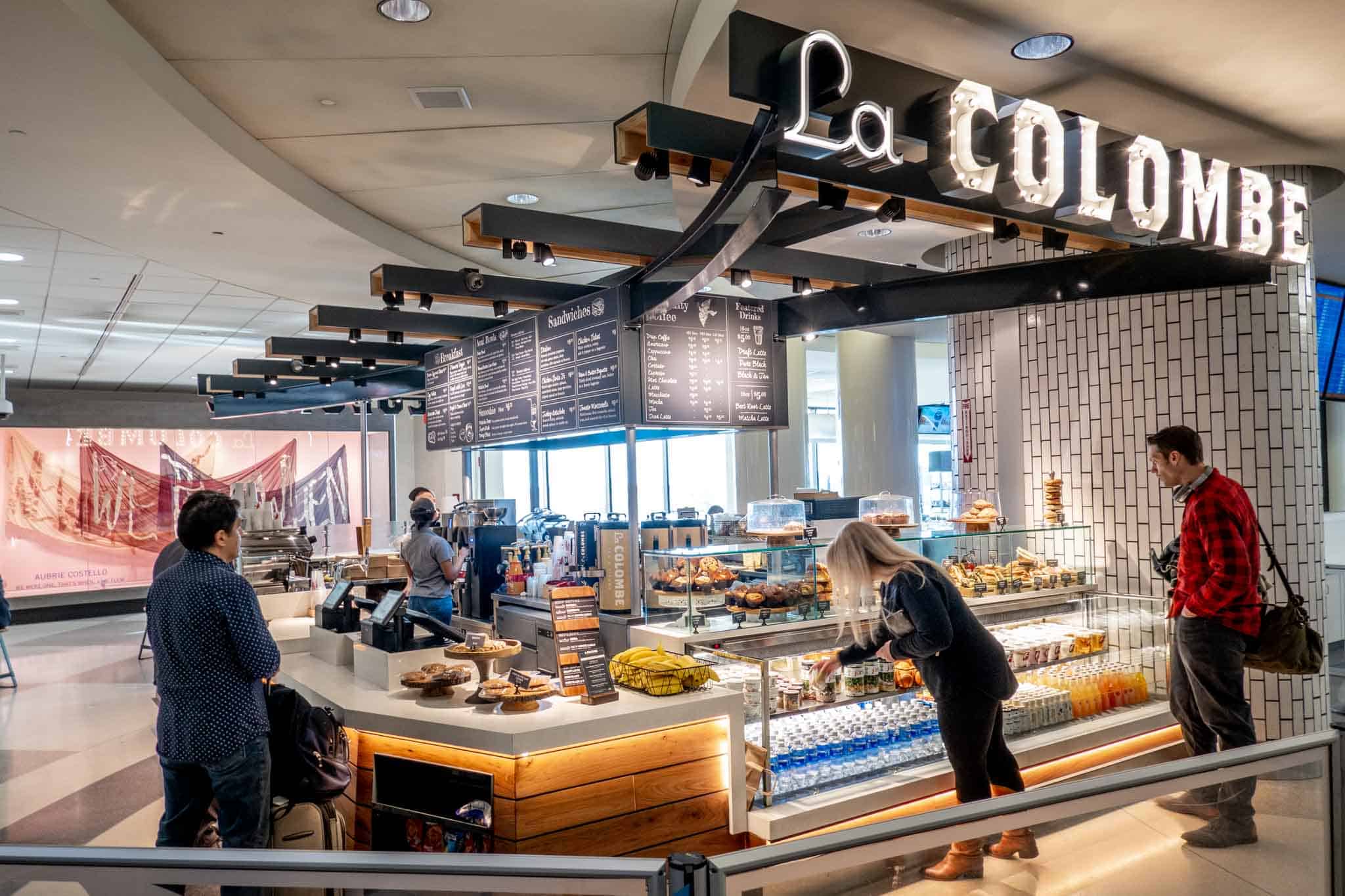 Customers buying food and drinks at La Colombe coffee bar