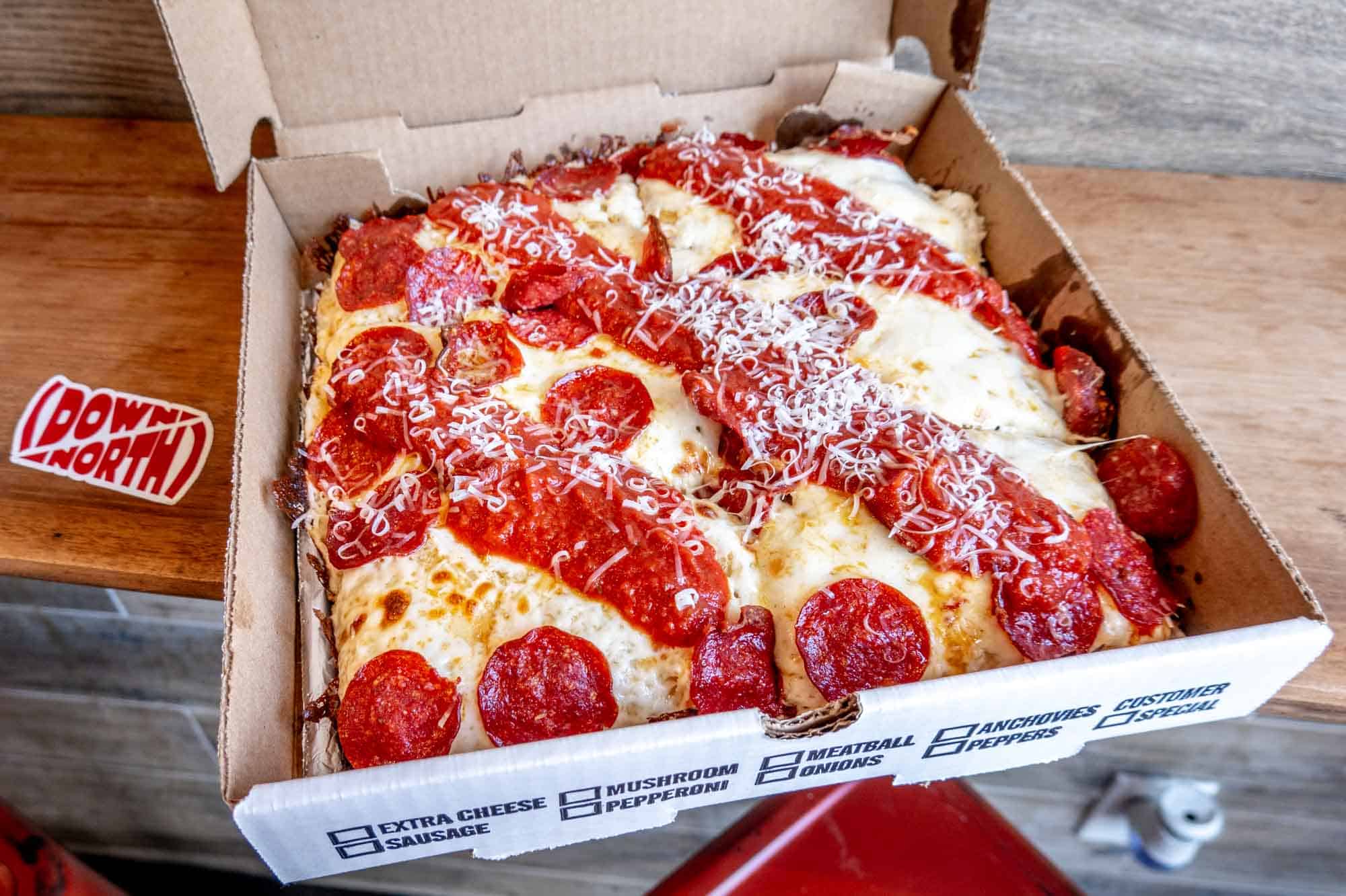 Square-style pizza from Down North in cardboard box