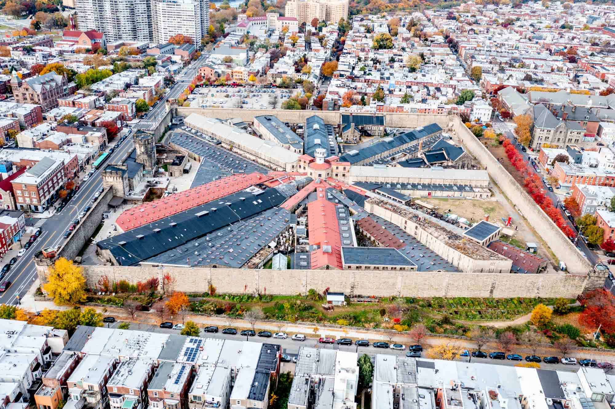 Overhead view of a large building with wings radiating from a center point.