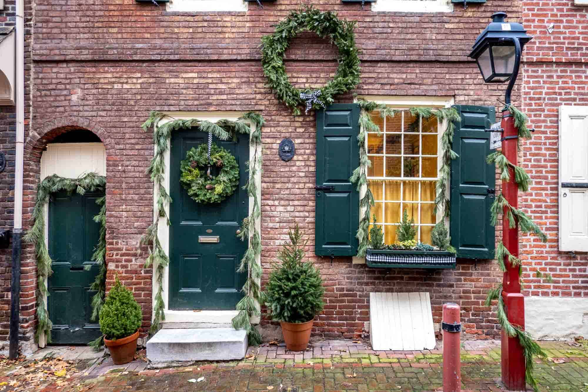 Home in Elfreth's Alley decorated with wreaths and garland