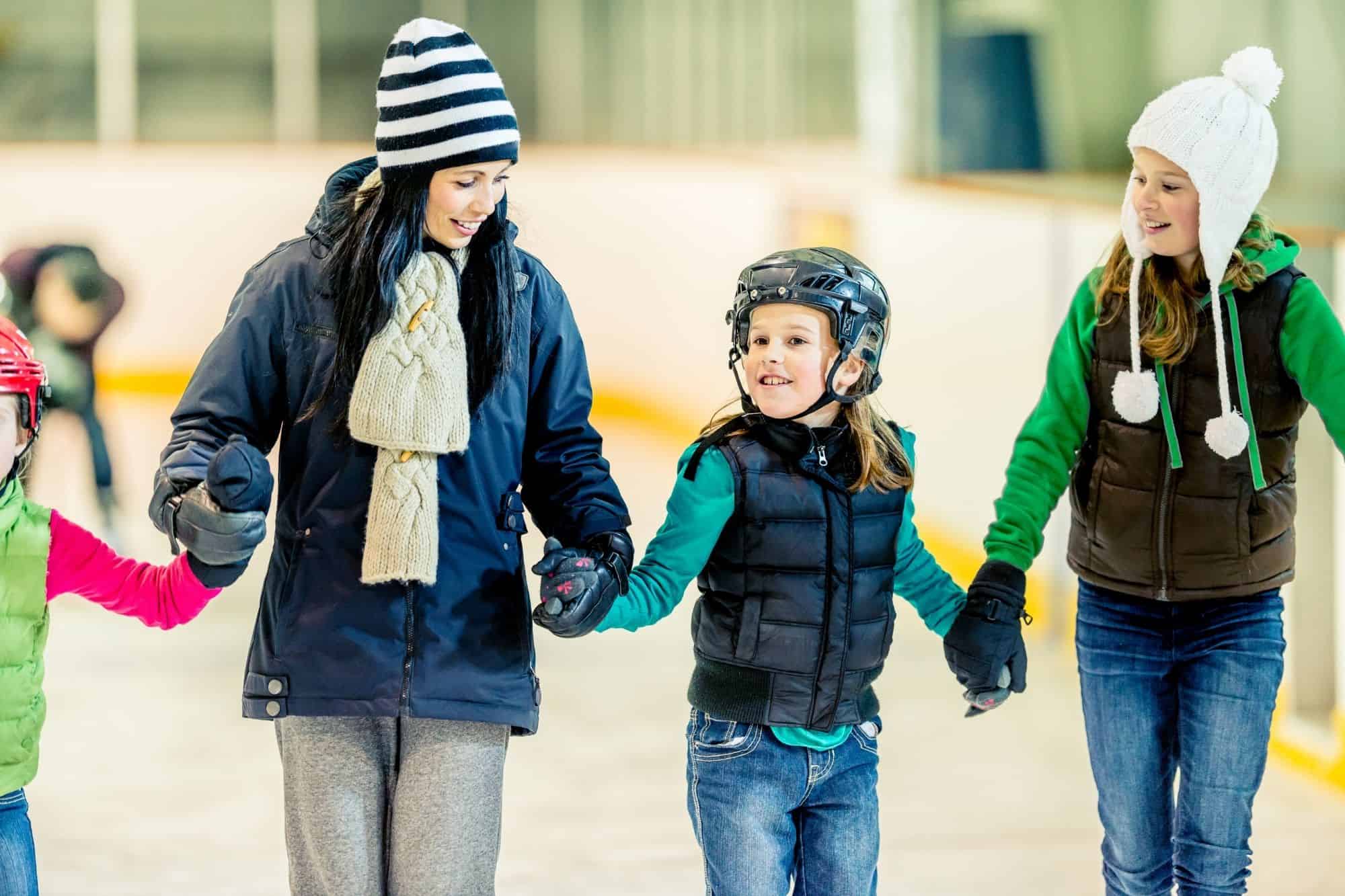 Family of four on an ice rink