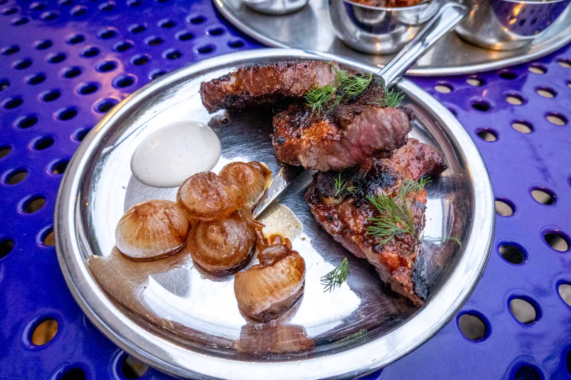 Short rib and onions on steel plate