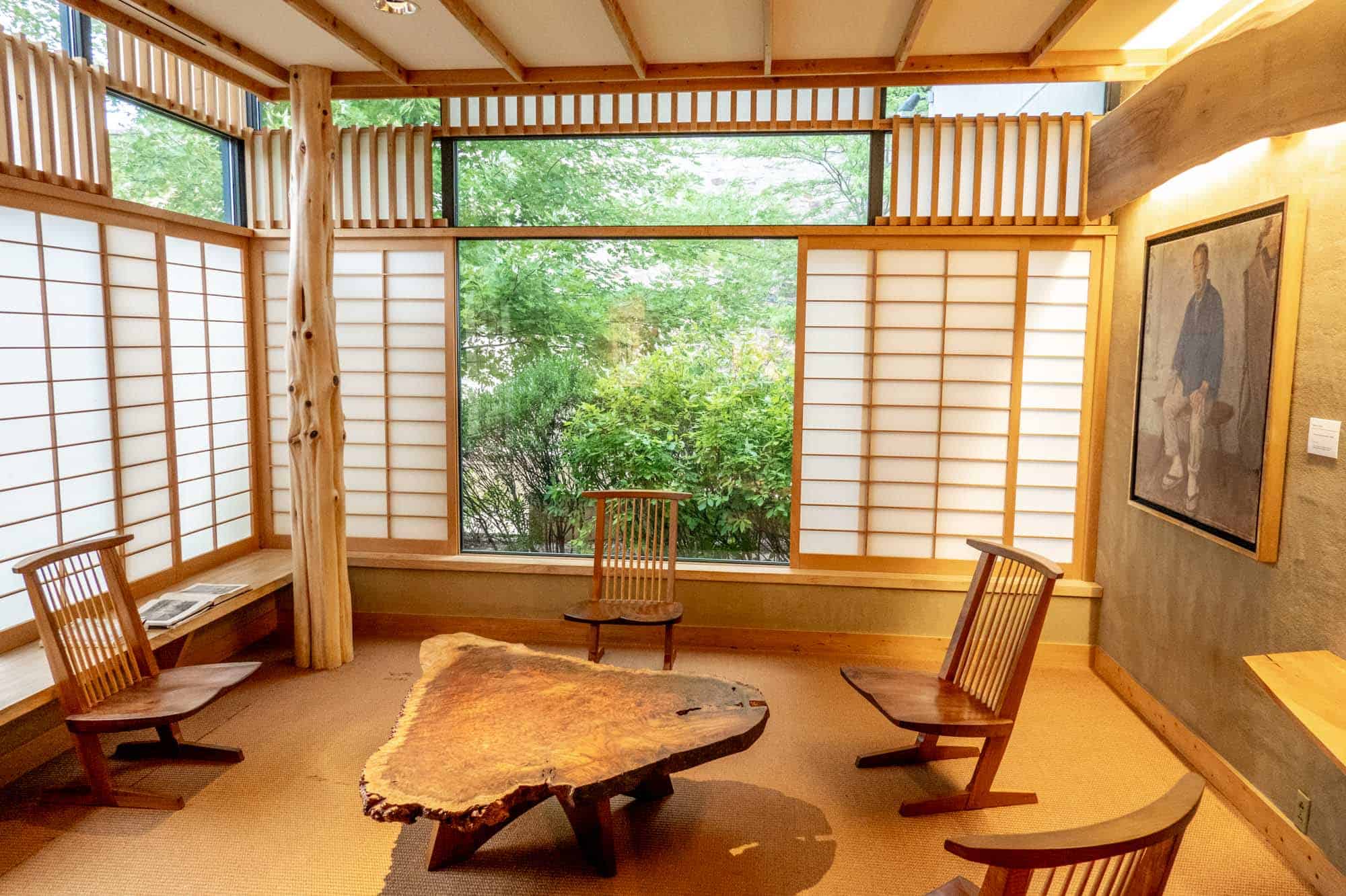 Room with wooden chairs and table and Japanese-style window coverings