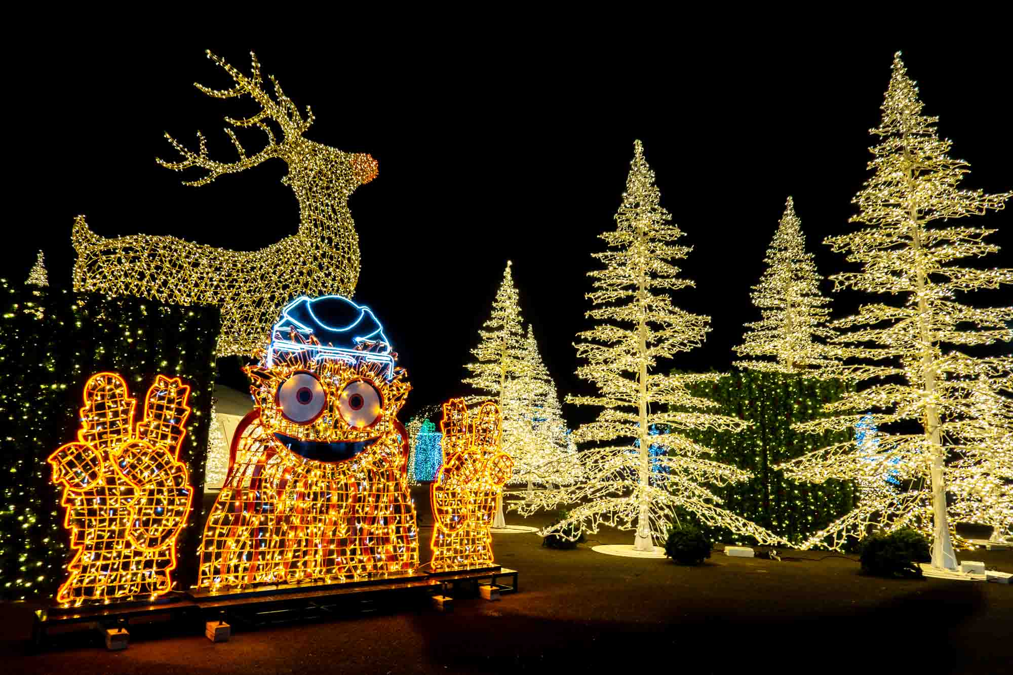 Illuminated Gritty mascot, plus Christmas trees and reindeer.