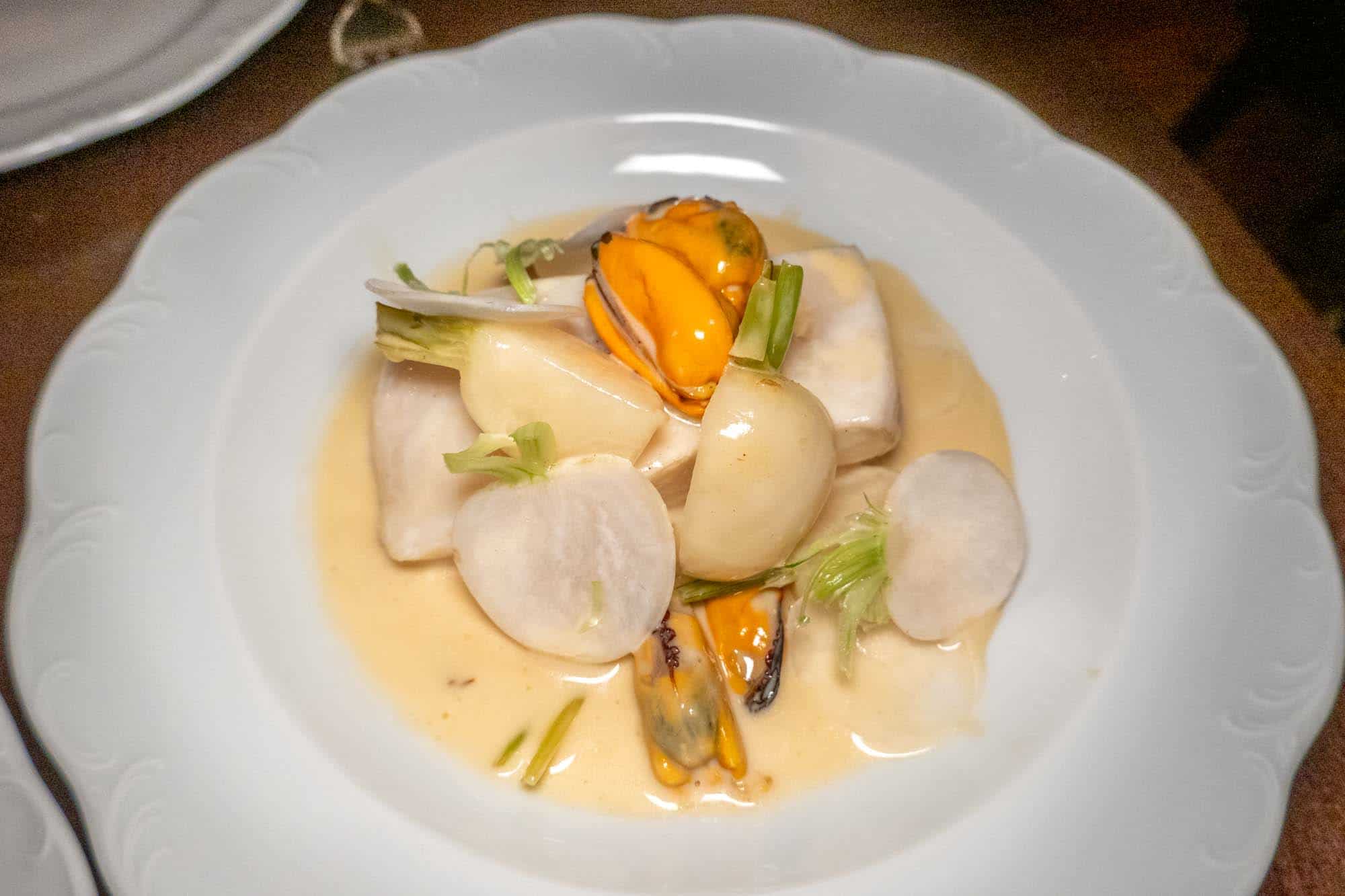 Halibut with turnips topped with mussels