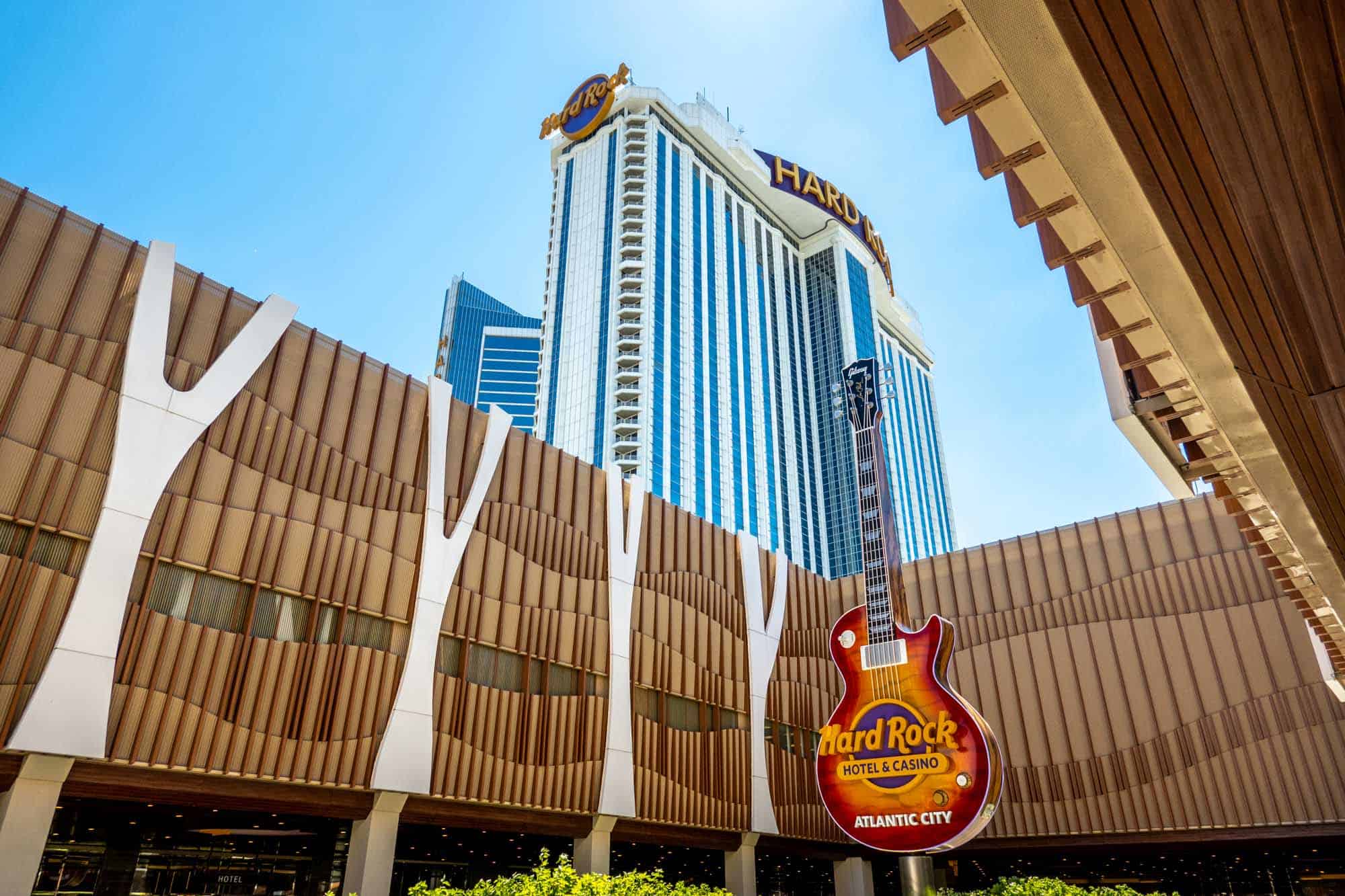 Exterior of a brown building with a giant guitar labeled "Hard Rock Hotel & Casino Atlantic City"