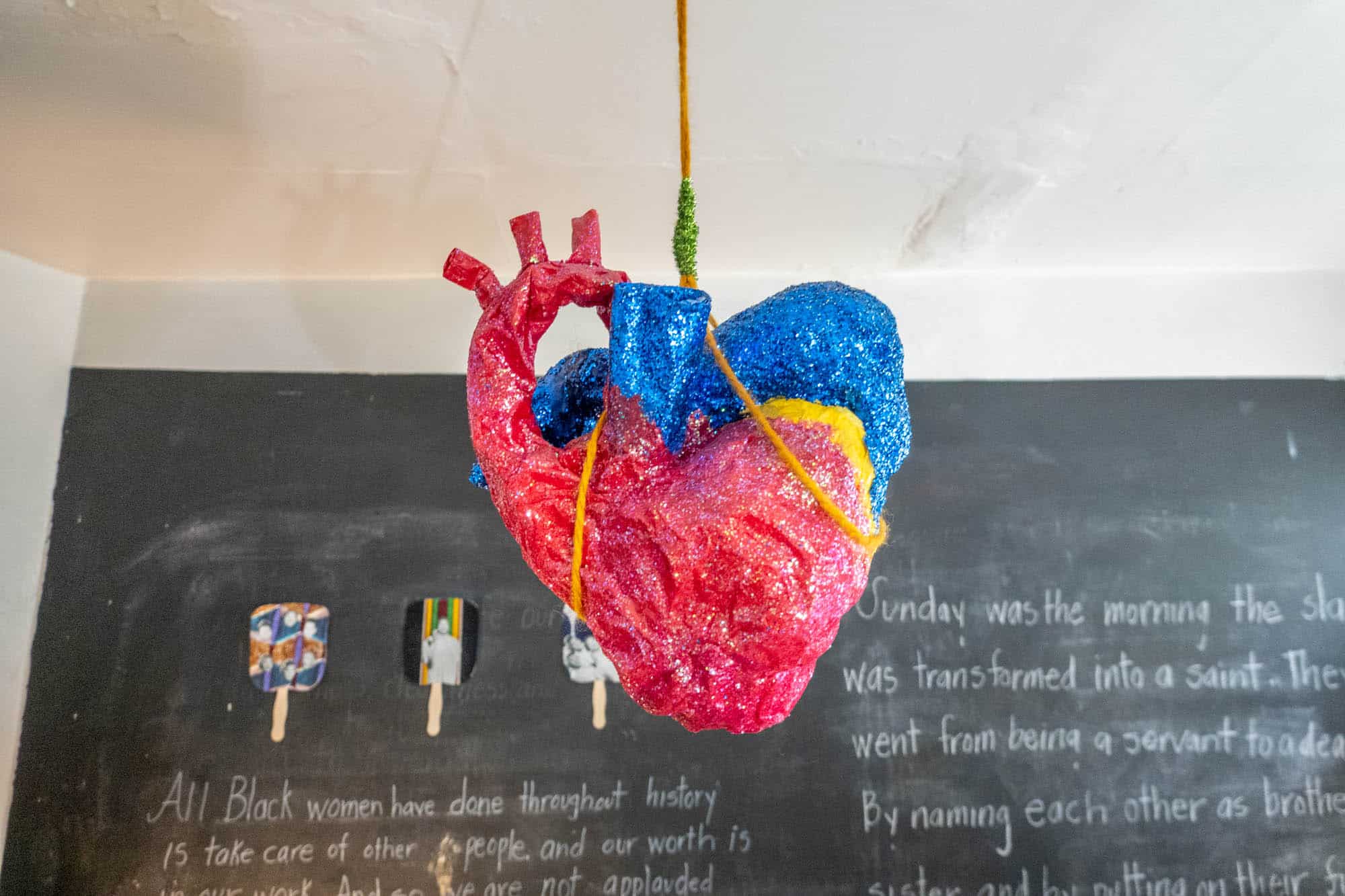 A stylized heart sculpture hanging from the ceiling.