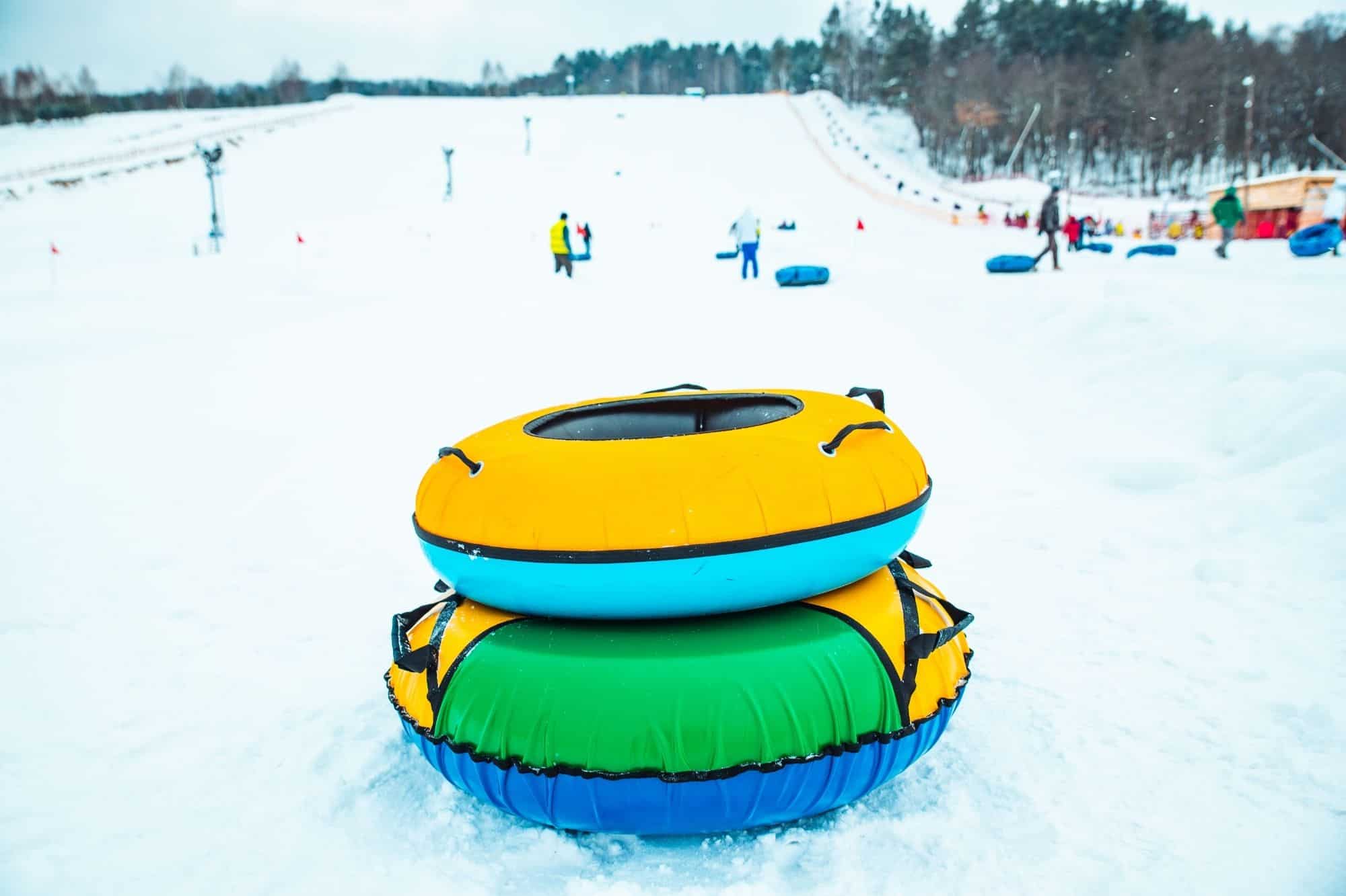 Two colorful tubes at the bottom of the mountain