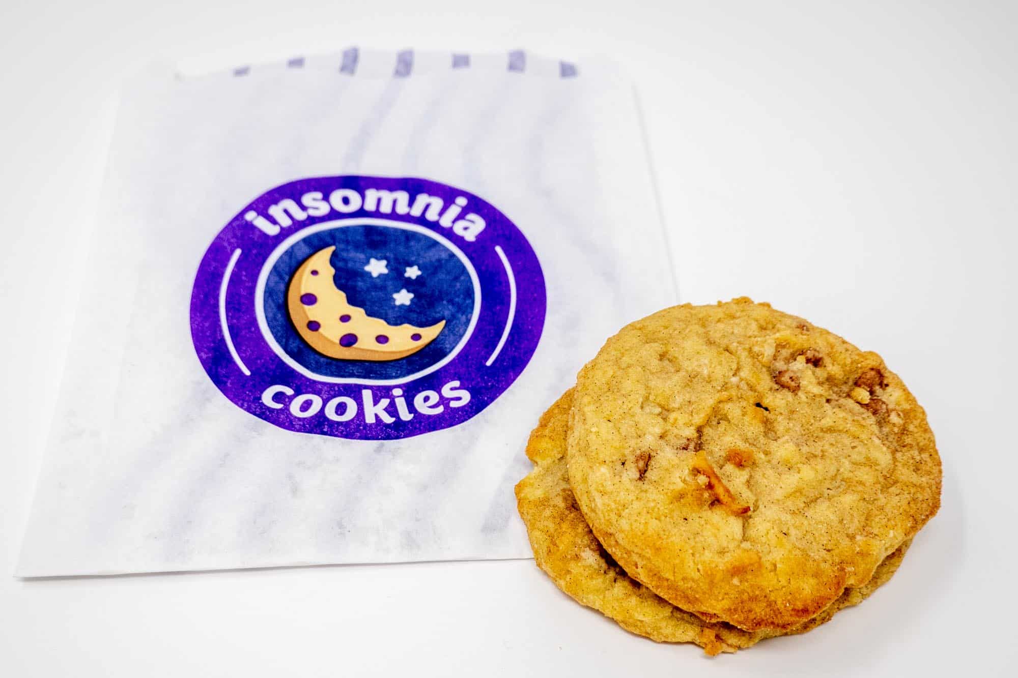 Two cookies and an Insomnia Cookies bag