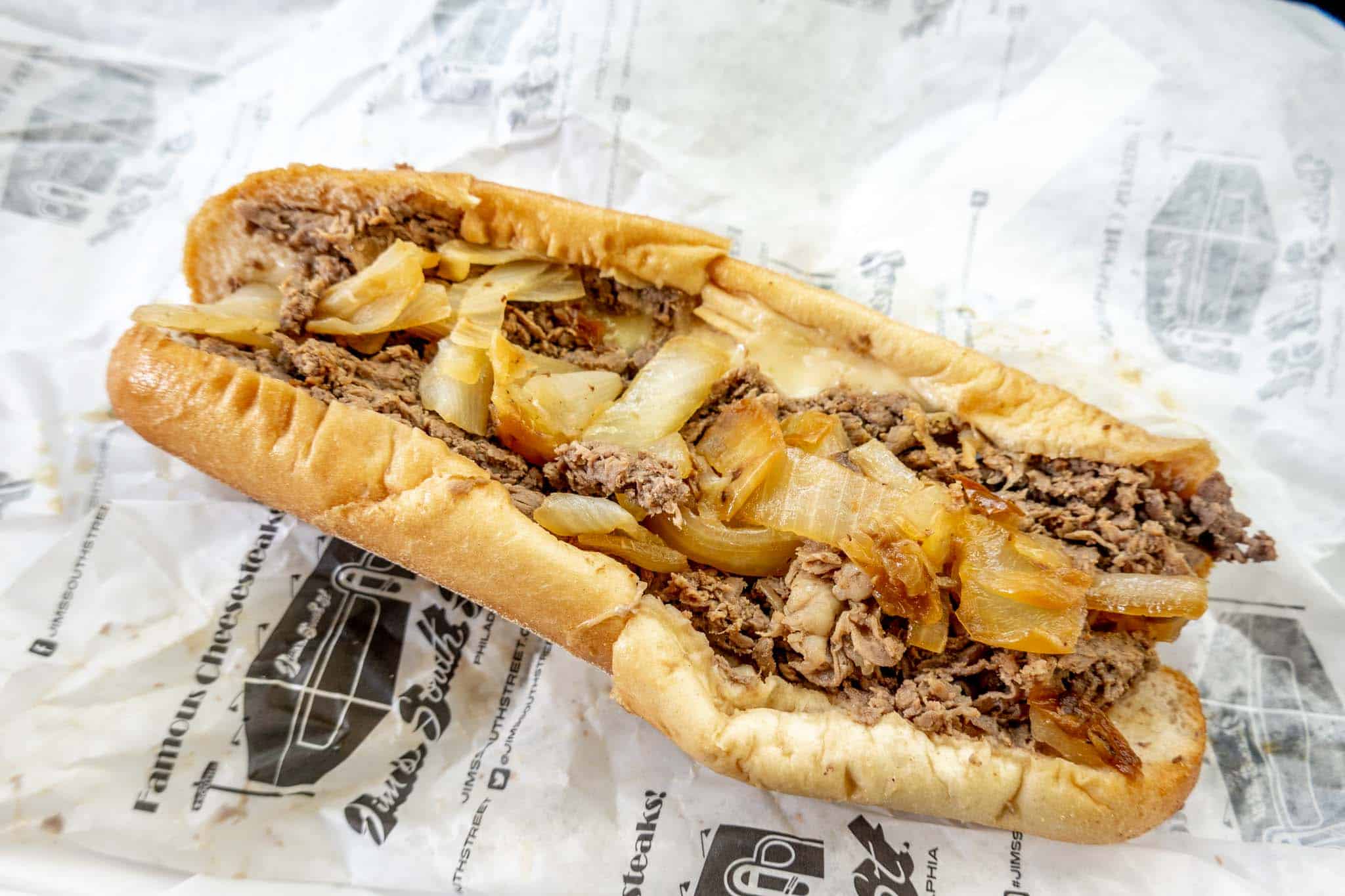 Cheesesteak with large onion pieces.