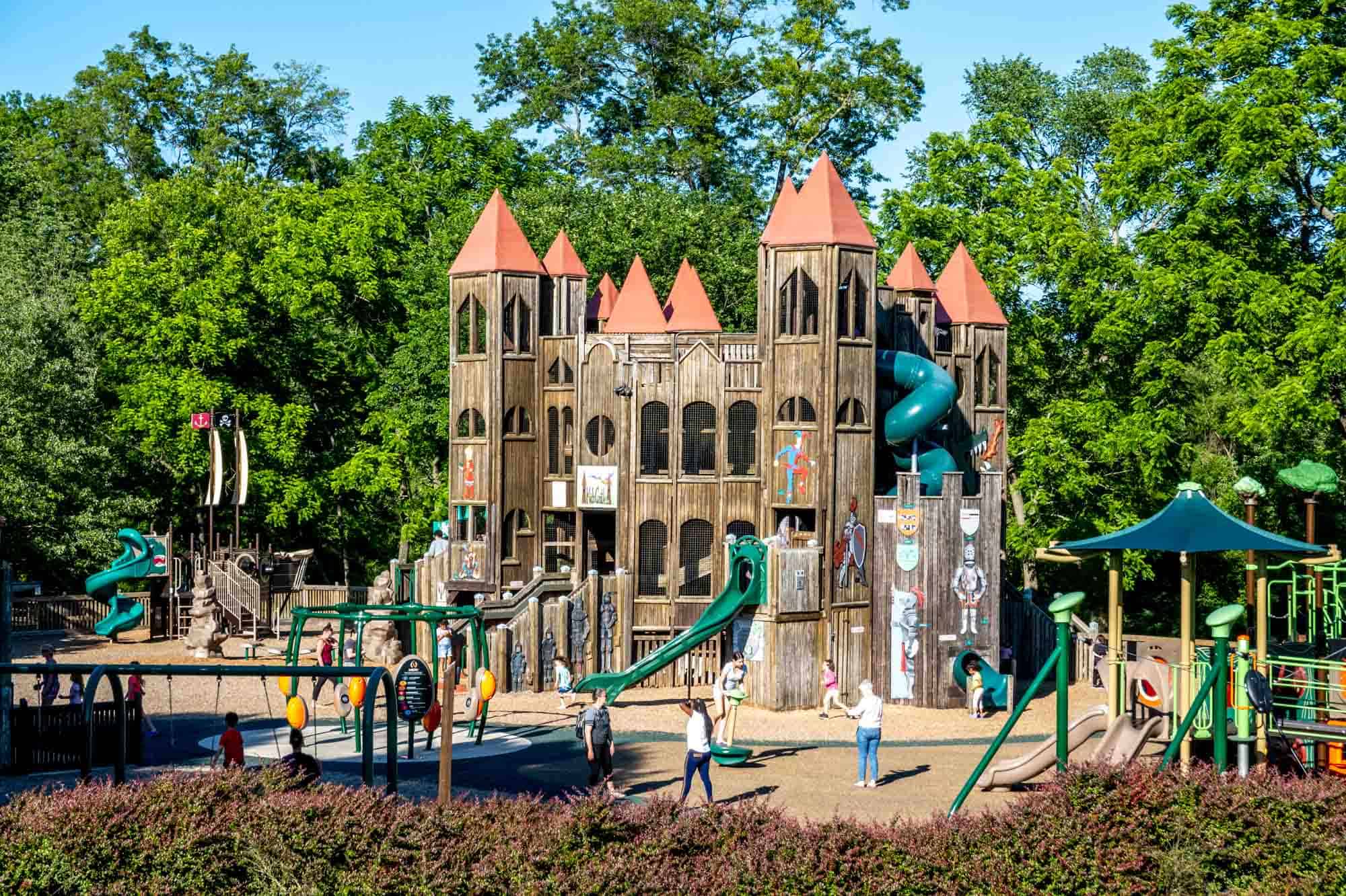 Wooden play structure shaped like a castle