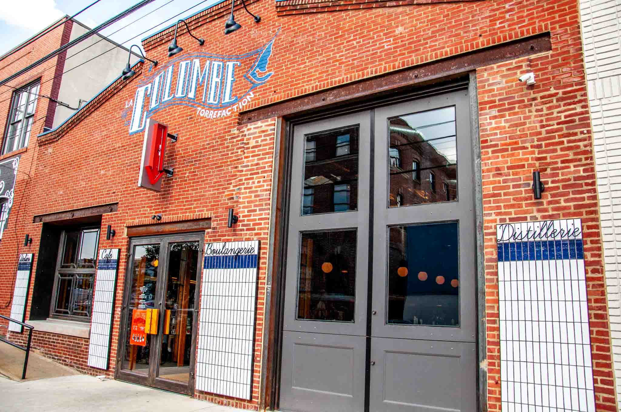 Exterior of a cafe with a sign for "La Colombe Torrefaction."