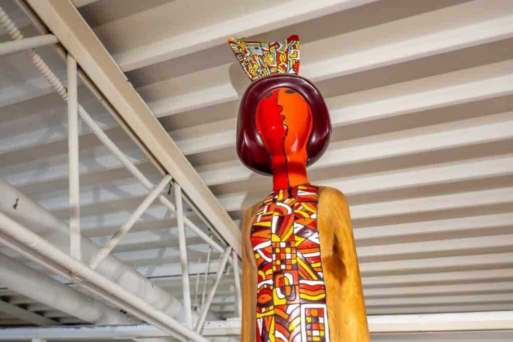Carved wood statue of a woman at the Museum for Art in Wood.