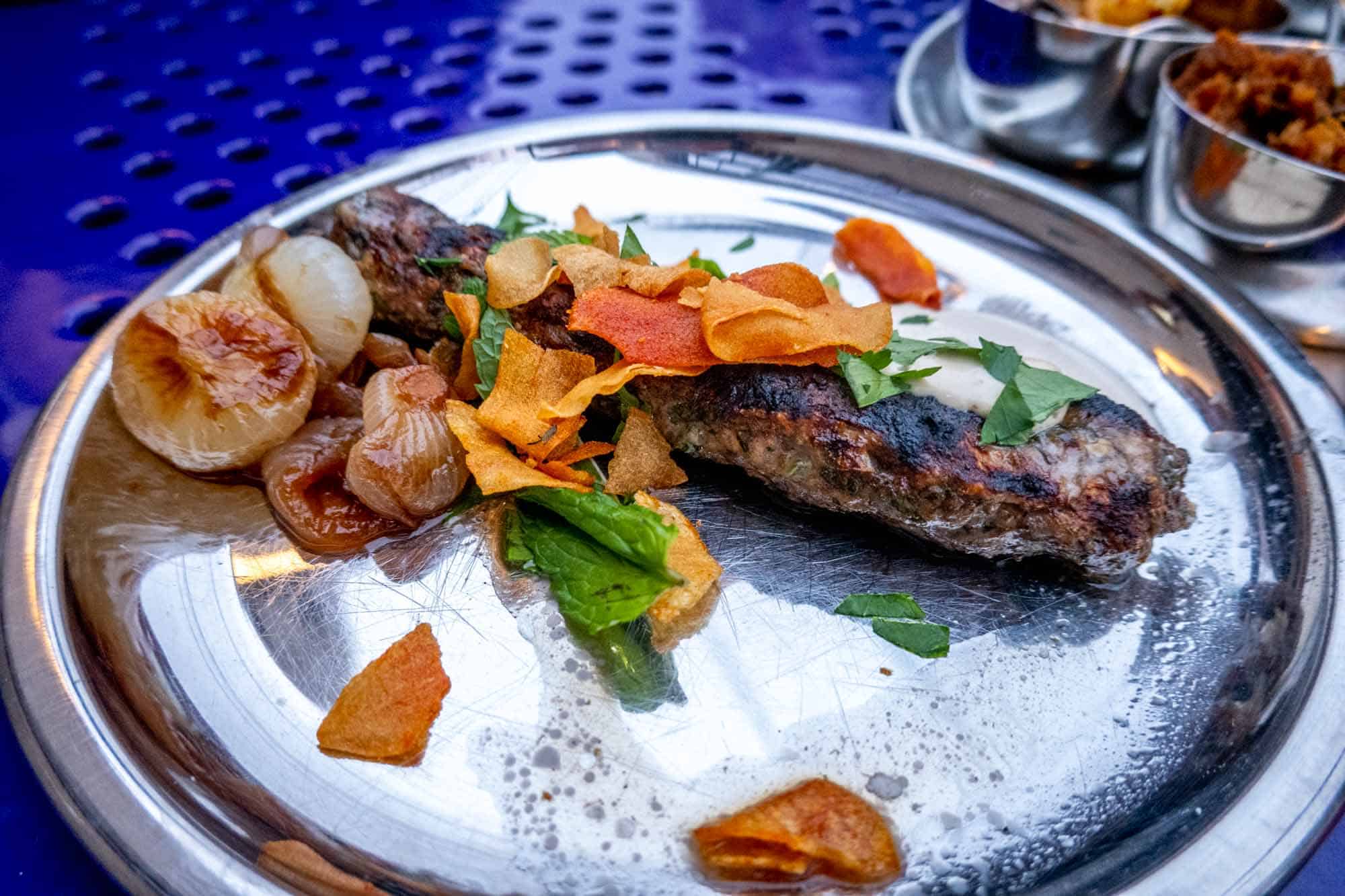 Lamb kofte on steel plate