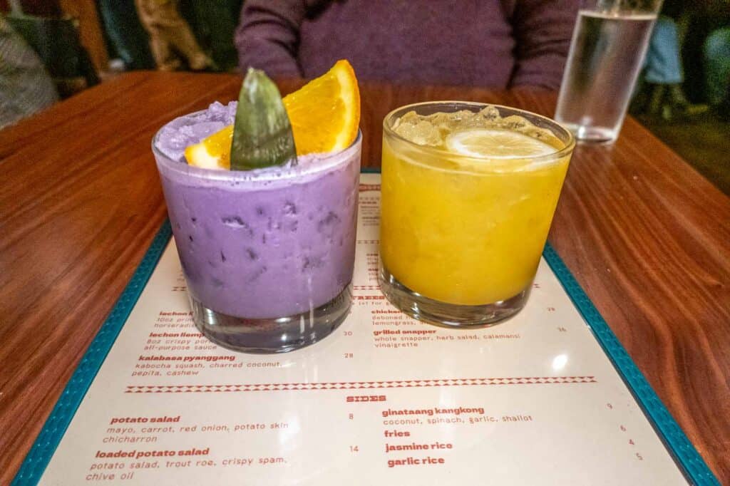 Two cocktails on top of a menu at Manong.