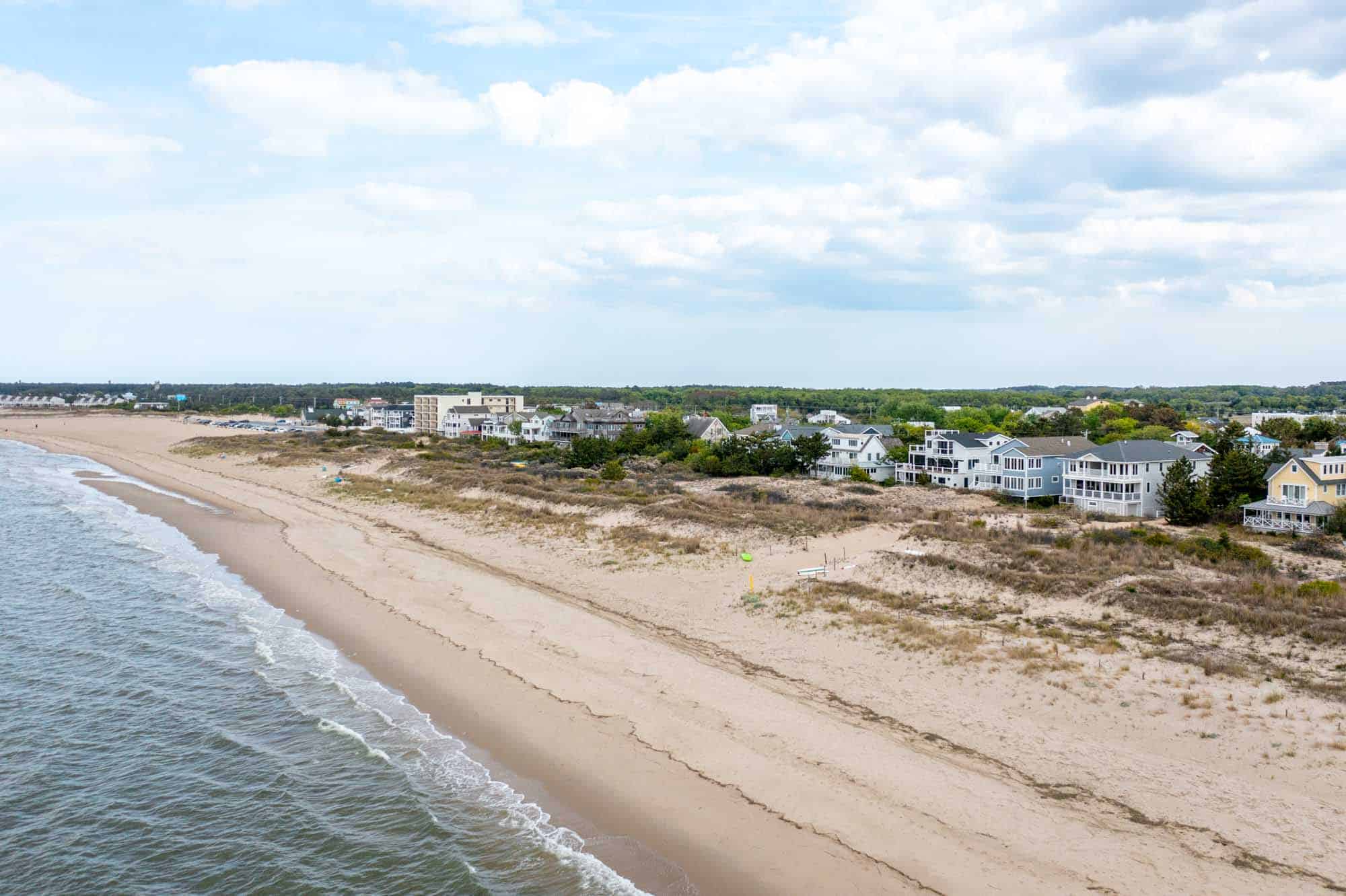 Overhead view of homes along the beach and ocean