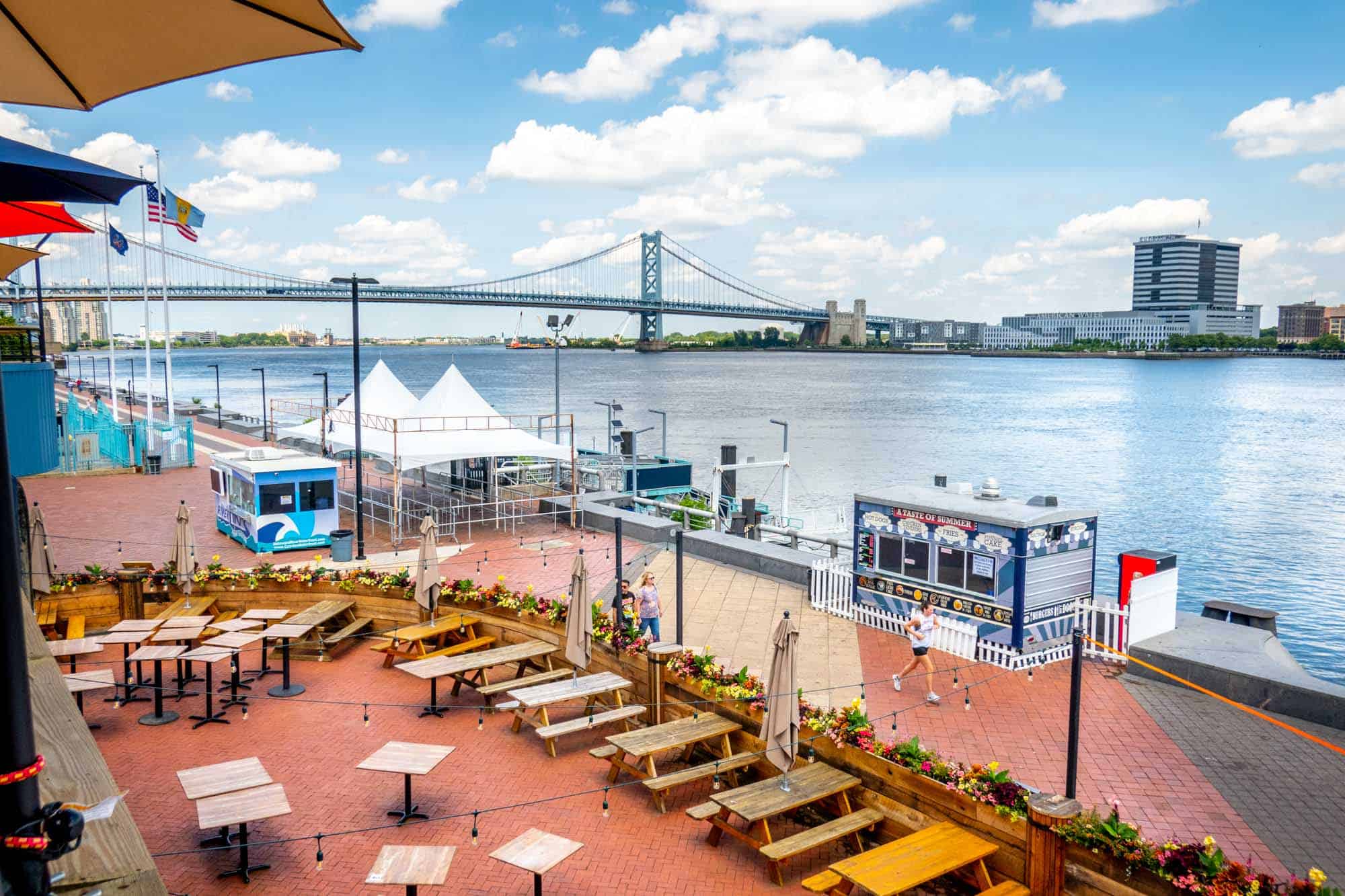 Picnic tables at a riverside restaurant.