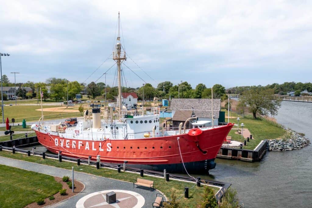 Red and white ship painted with "Overfalls" in Lewes, DE
