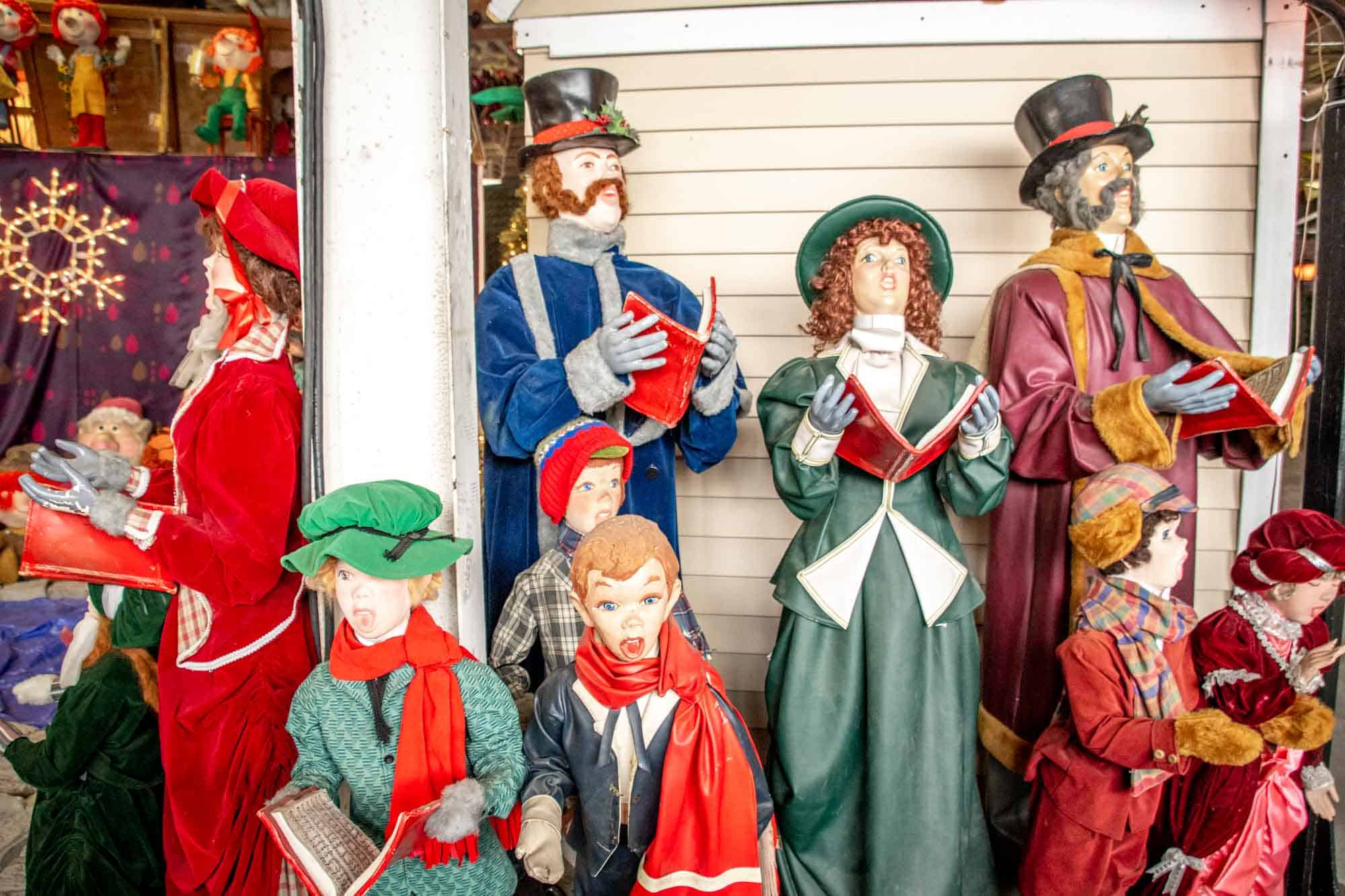Animatronic Christmas carolers in Victorian-style dress