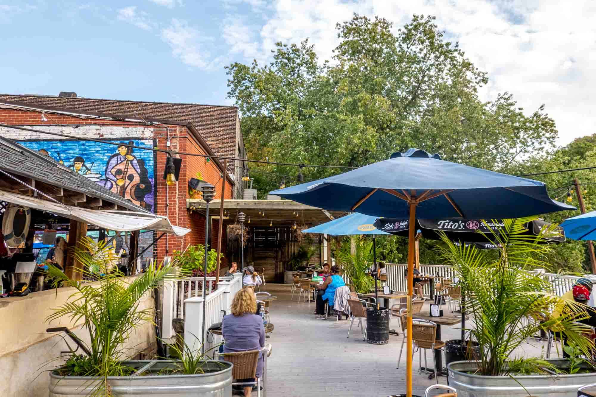 Tables with umbrellas on outdoor patio.