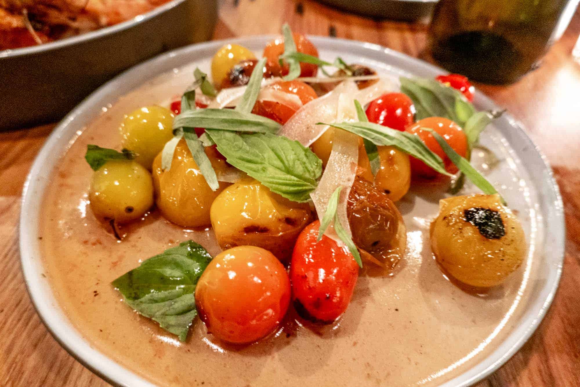 Plate of cherry tomatoes and basil