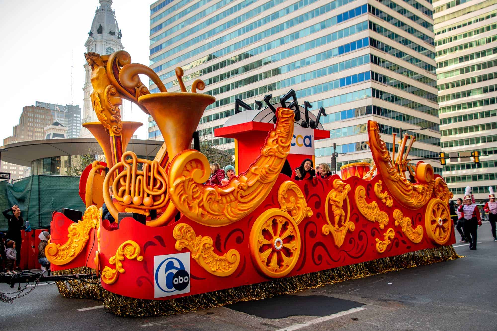 Music float in Thanksgiving parade with 6abc logo on it