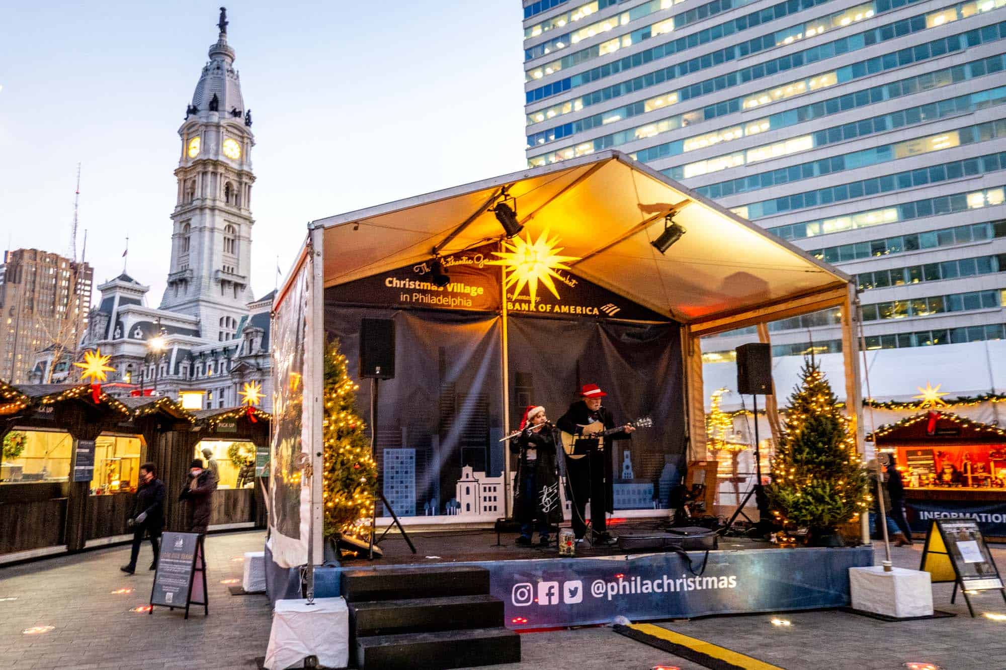 Flute player and guitar player on stage at the Christmas market