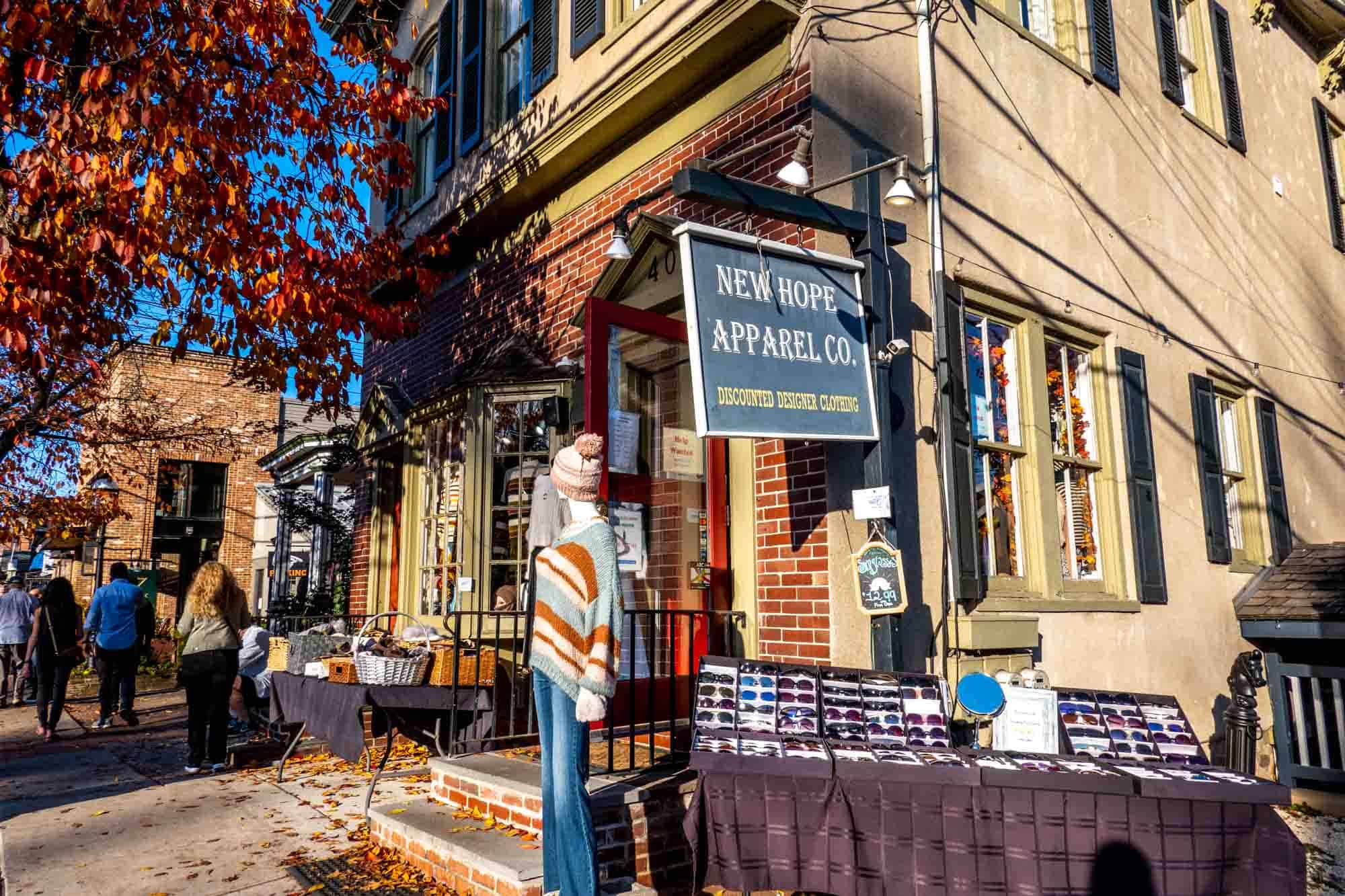 Sunglasses and clothes for sale outside New Hope Apparel Co.