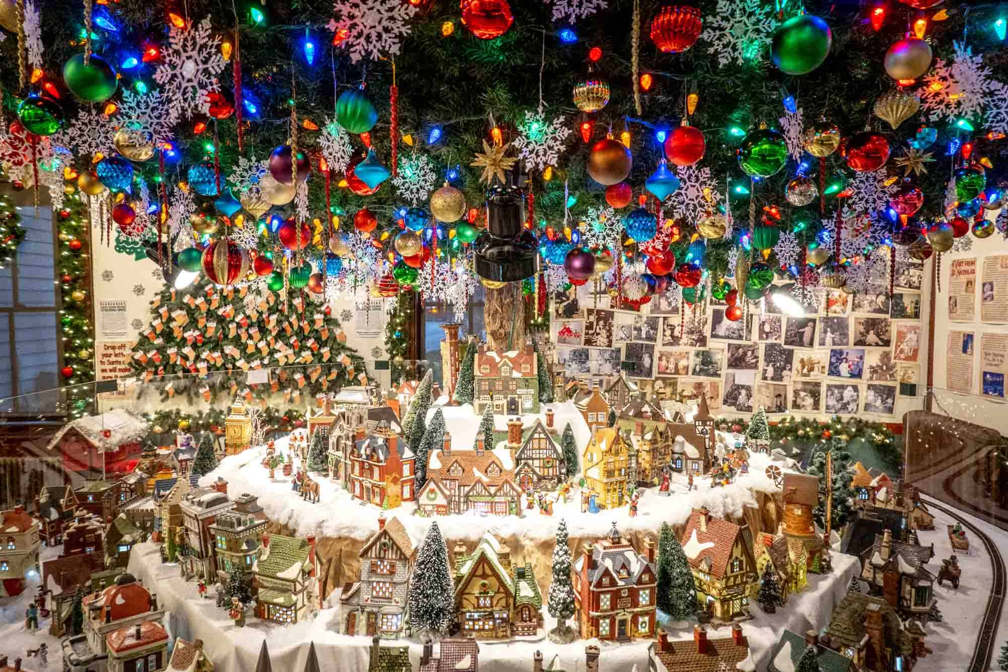 Exhibit featuring Christmas ornaments and miniature houses