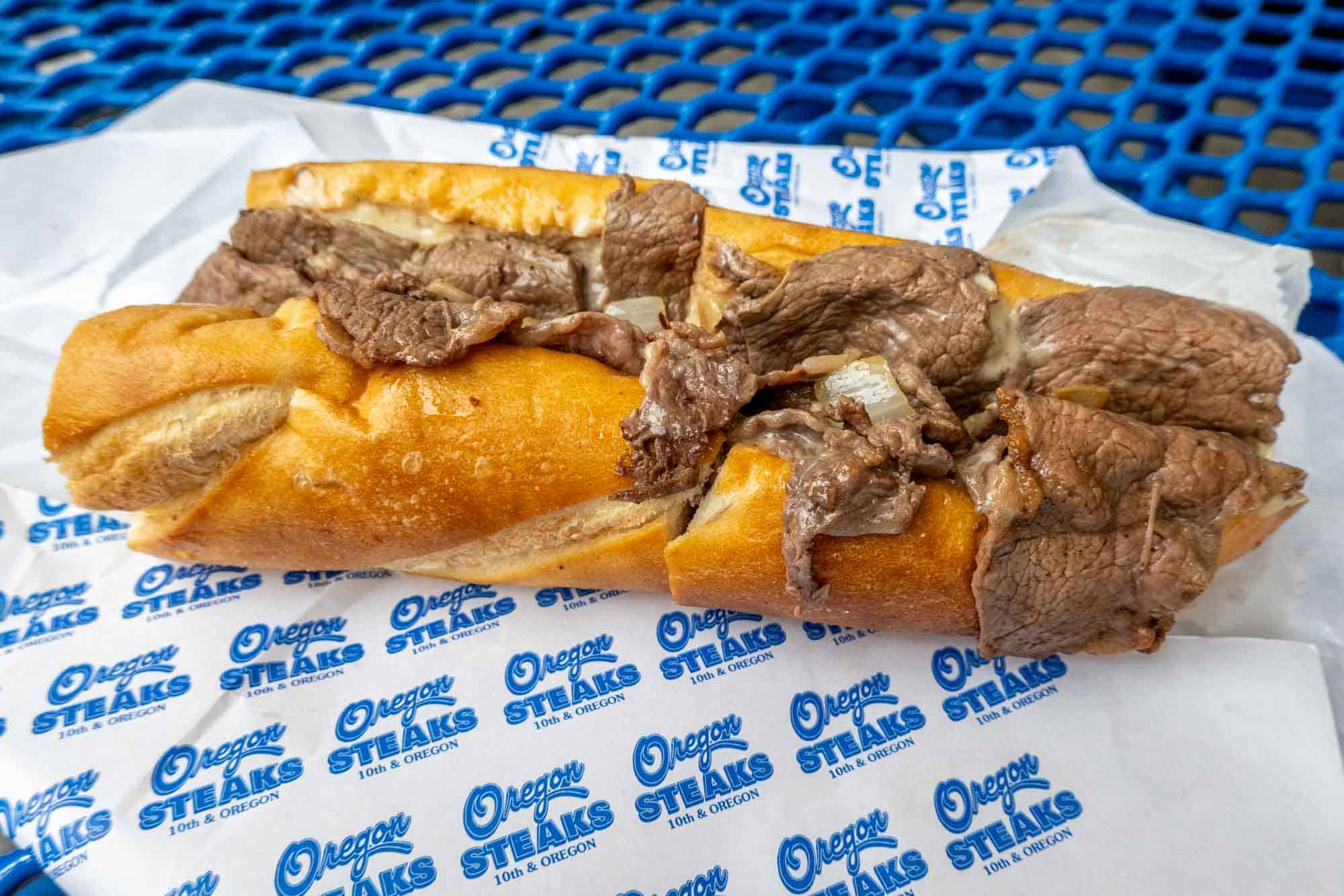 Cheesesteak on a wrapper that says Oregon Steaks