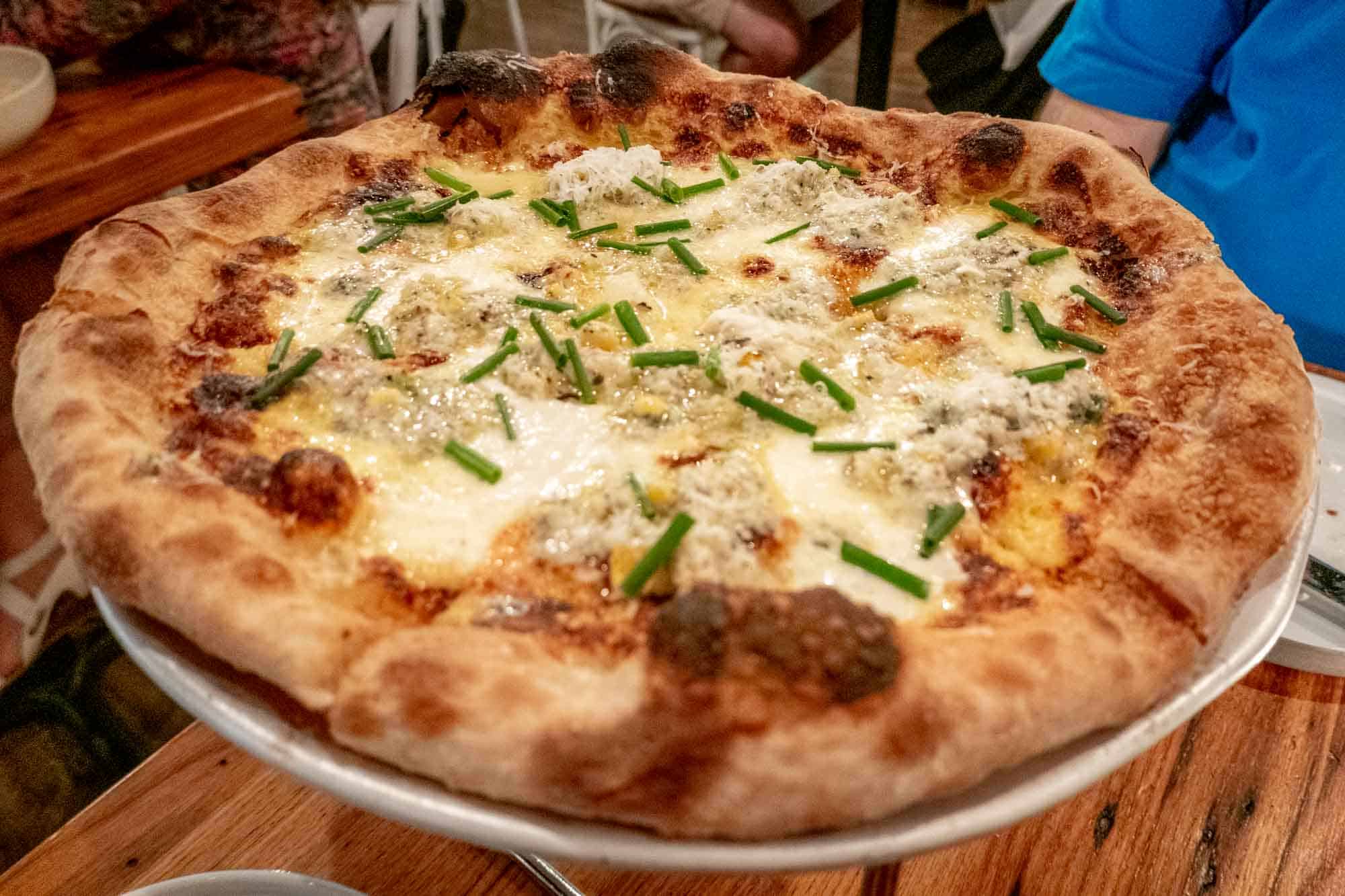 Truffle and corn pizza white pizza.