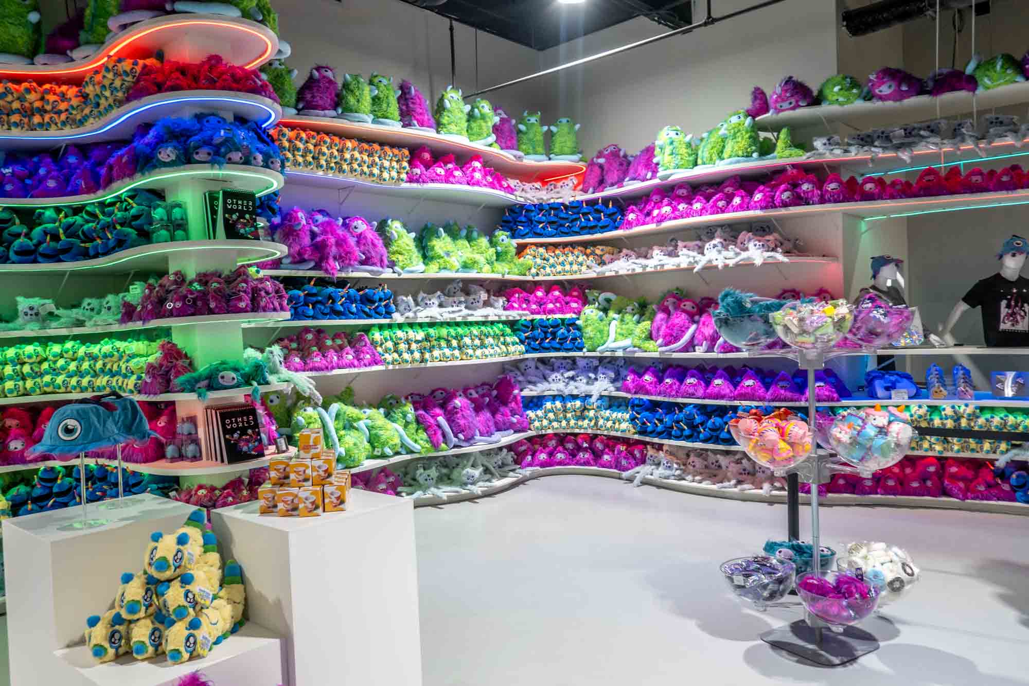 Giftshop with rows of plush aliens.