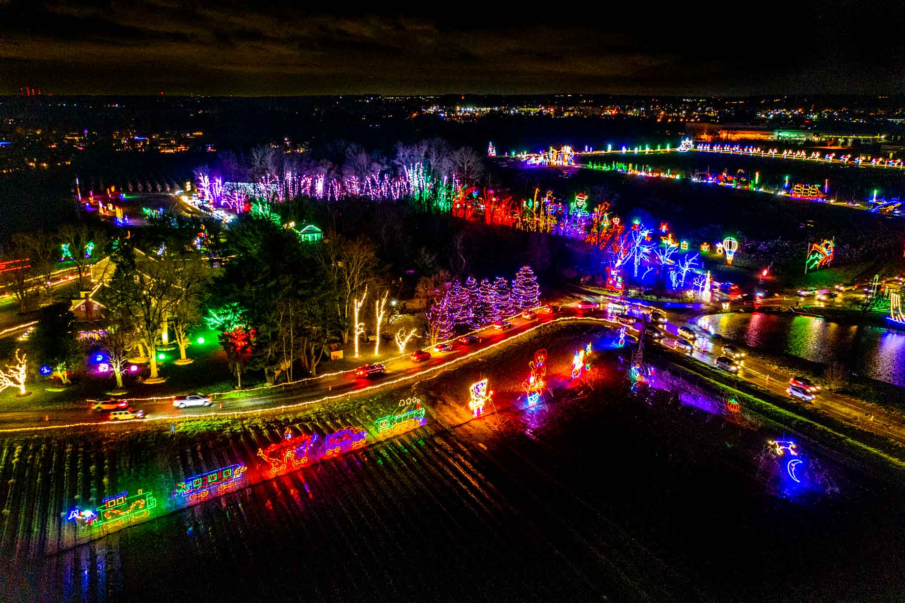 Overhead view of a Christmas light trail lit up at night