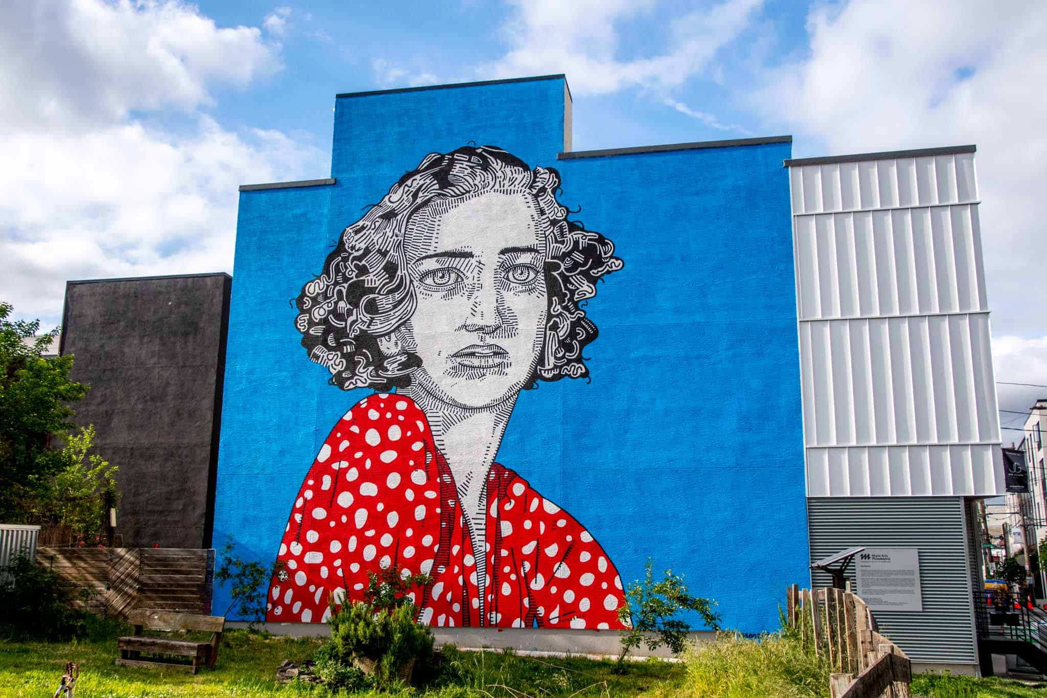 Persistence mural: a woman in a red polka dot dress